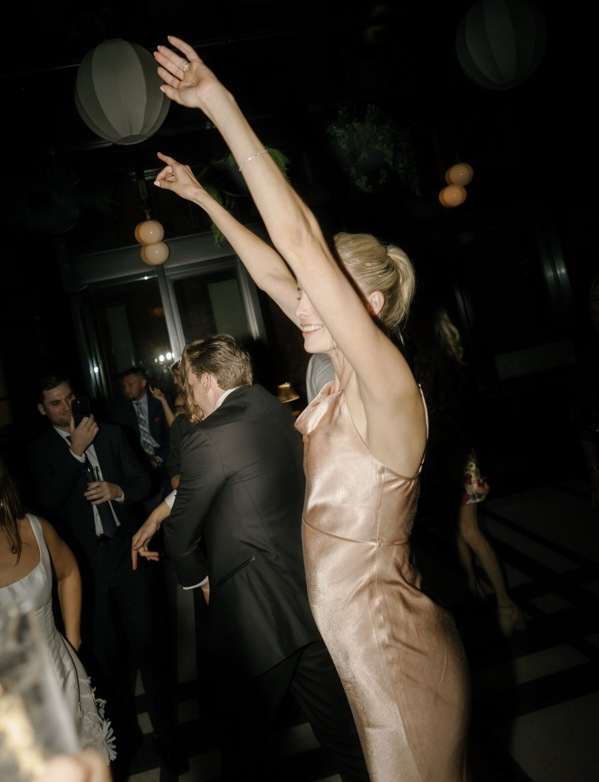 candid dancing wedding photos at Shinola Hotel, Detroit