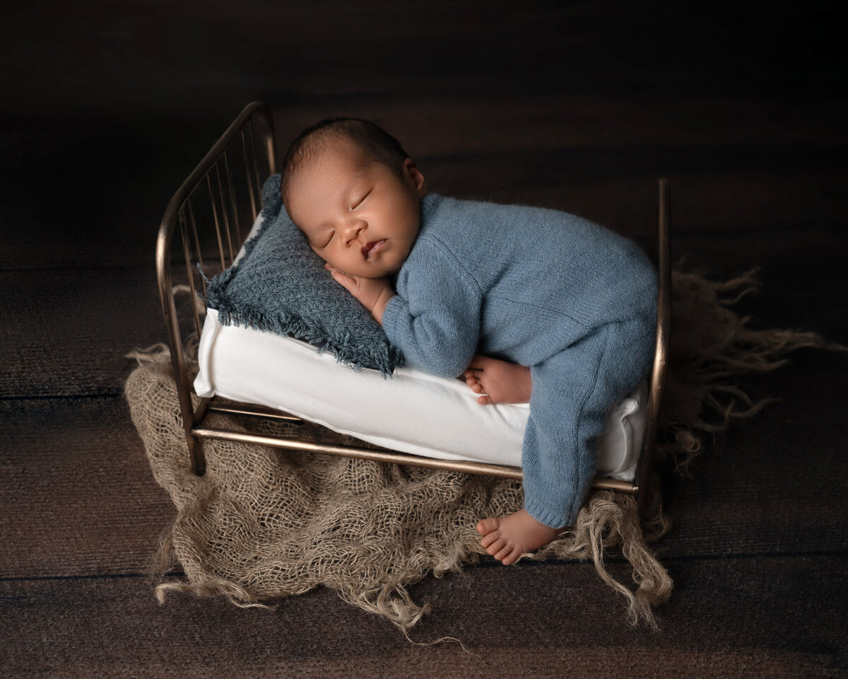 Newborn baby boy blue outfit sleeping Georgetown professional photographer