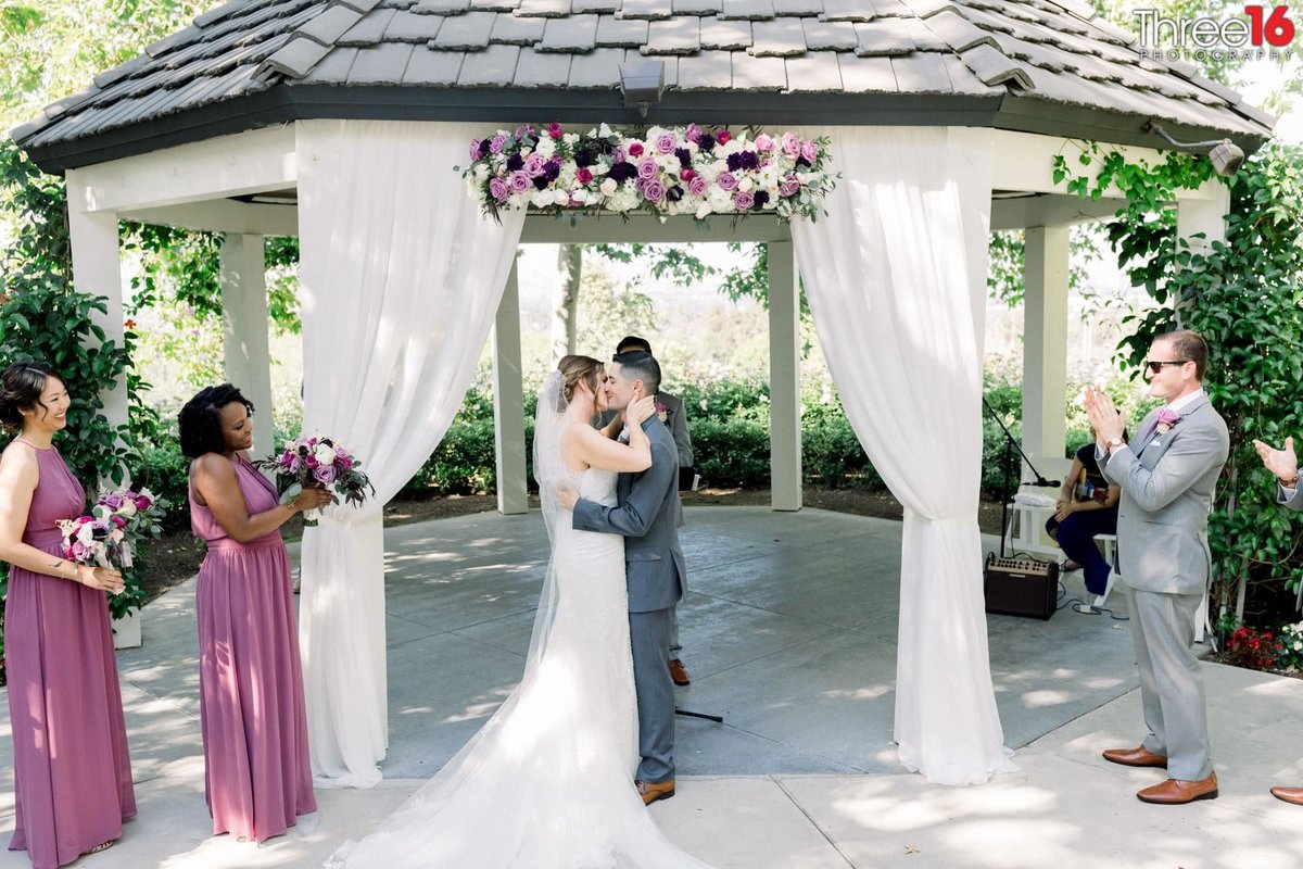 First kiss as Husband and Wife under the gazebo