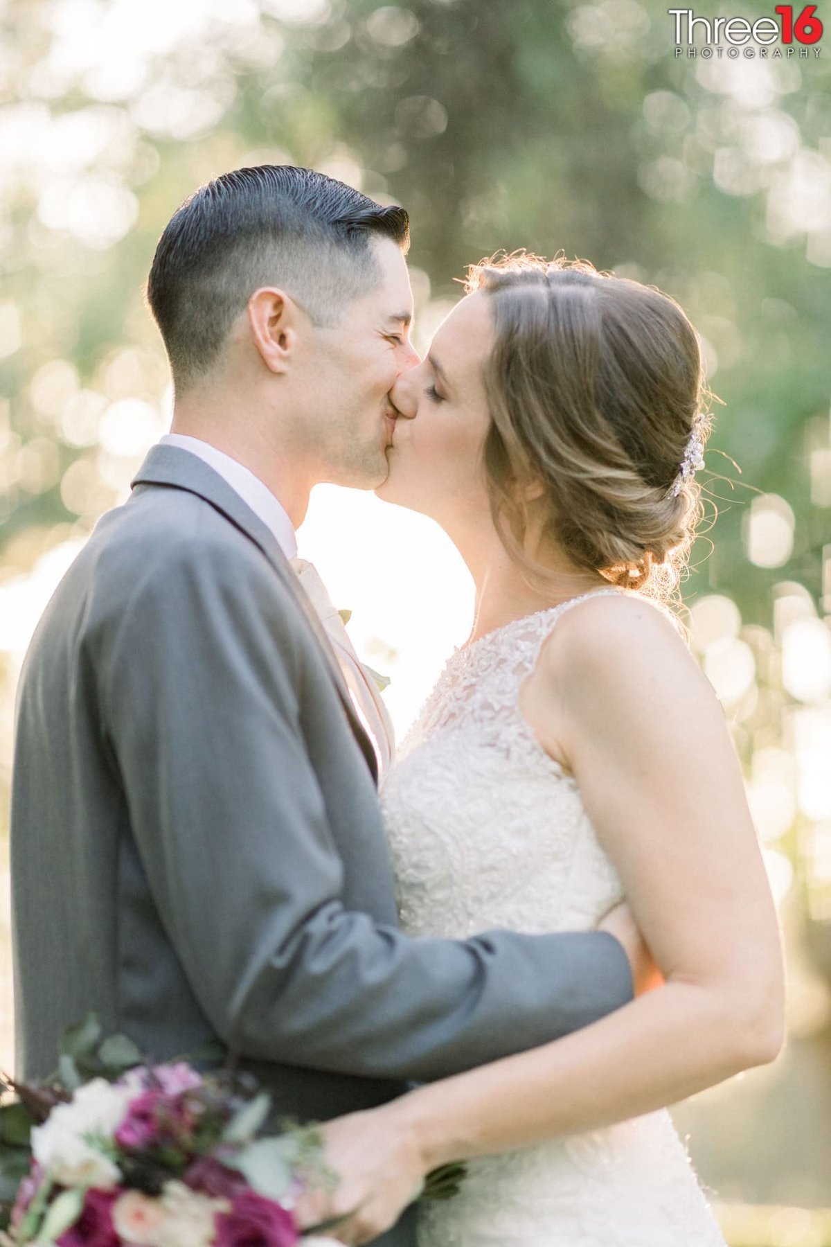 Bride and Groom share a romantic kiss
