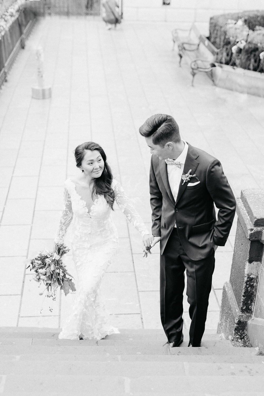 black and white portrait of bride and groom at charles bridge