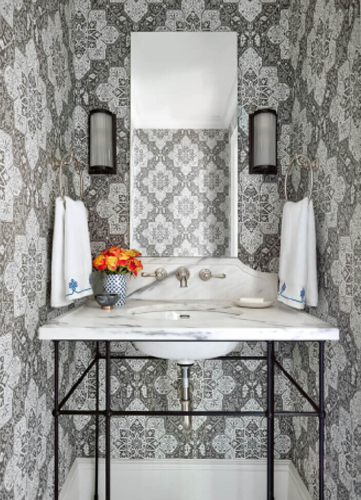 Powder Room Design features Thibaut wallpaper, a custom marble and metal sink console, and Visual Comfort wall sconces in a Boston brownstone renovation project.