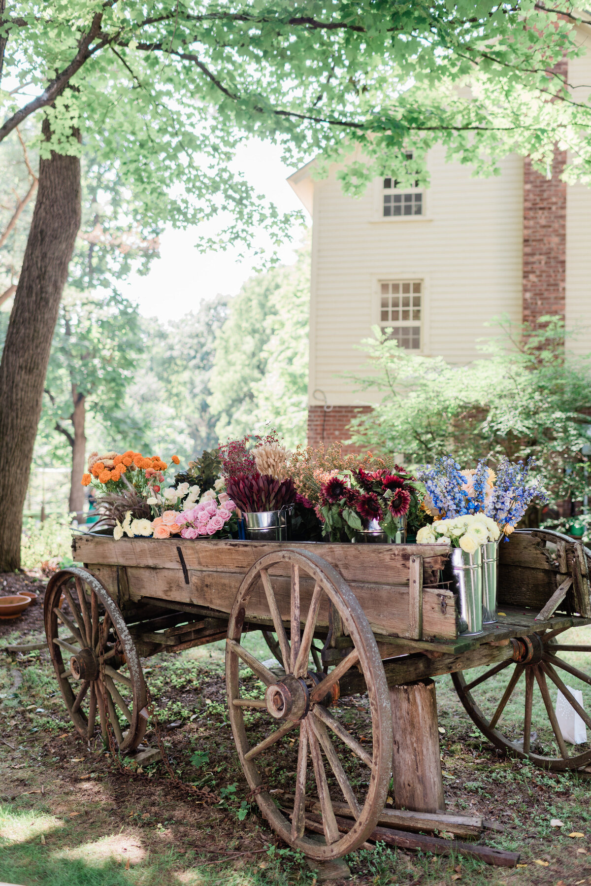 Floral arrangements in a wooden carriage 