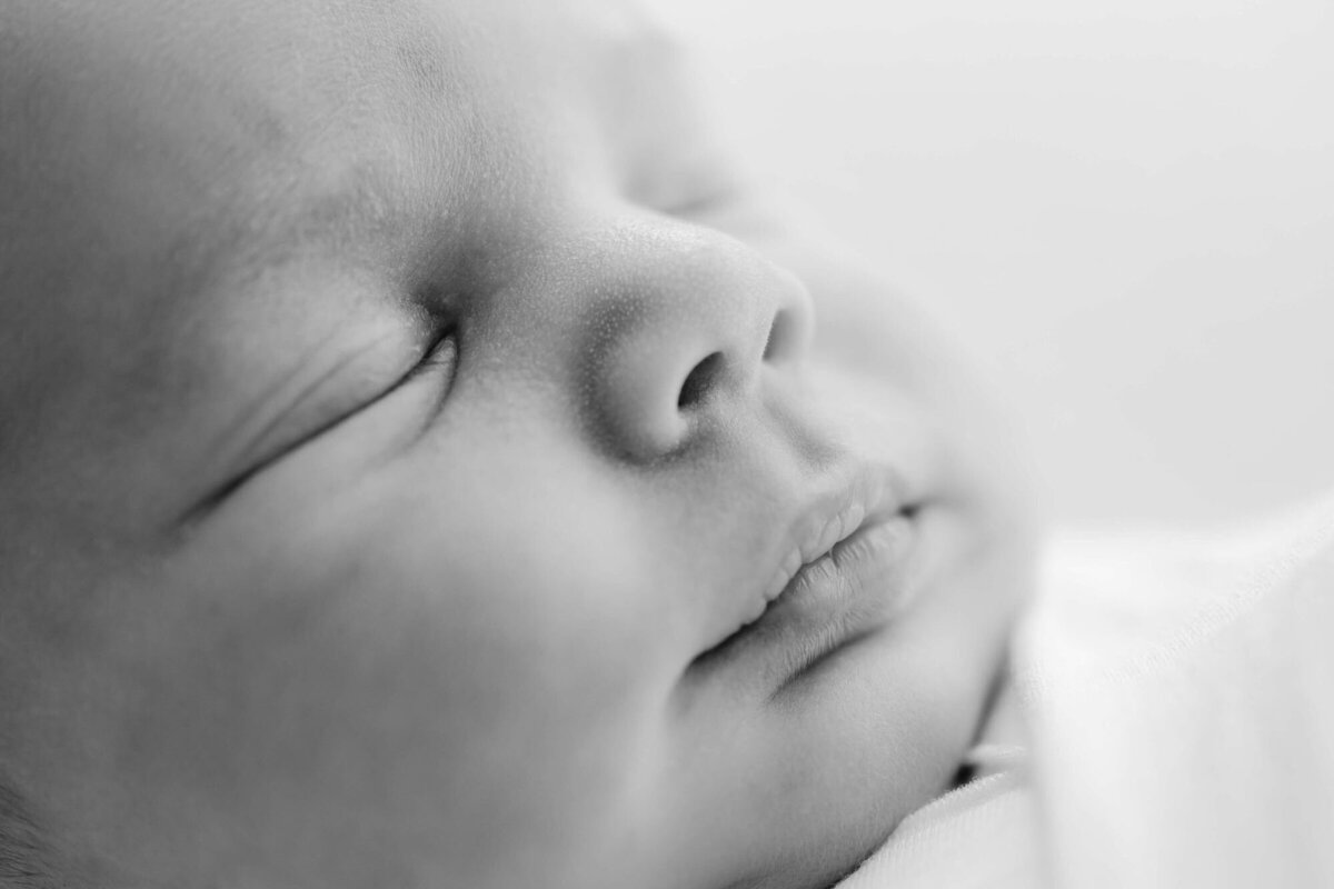 Baby wrapped in neutral swaddle, captured by San Francisco Bay Area newborn photographer.