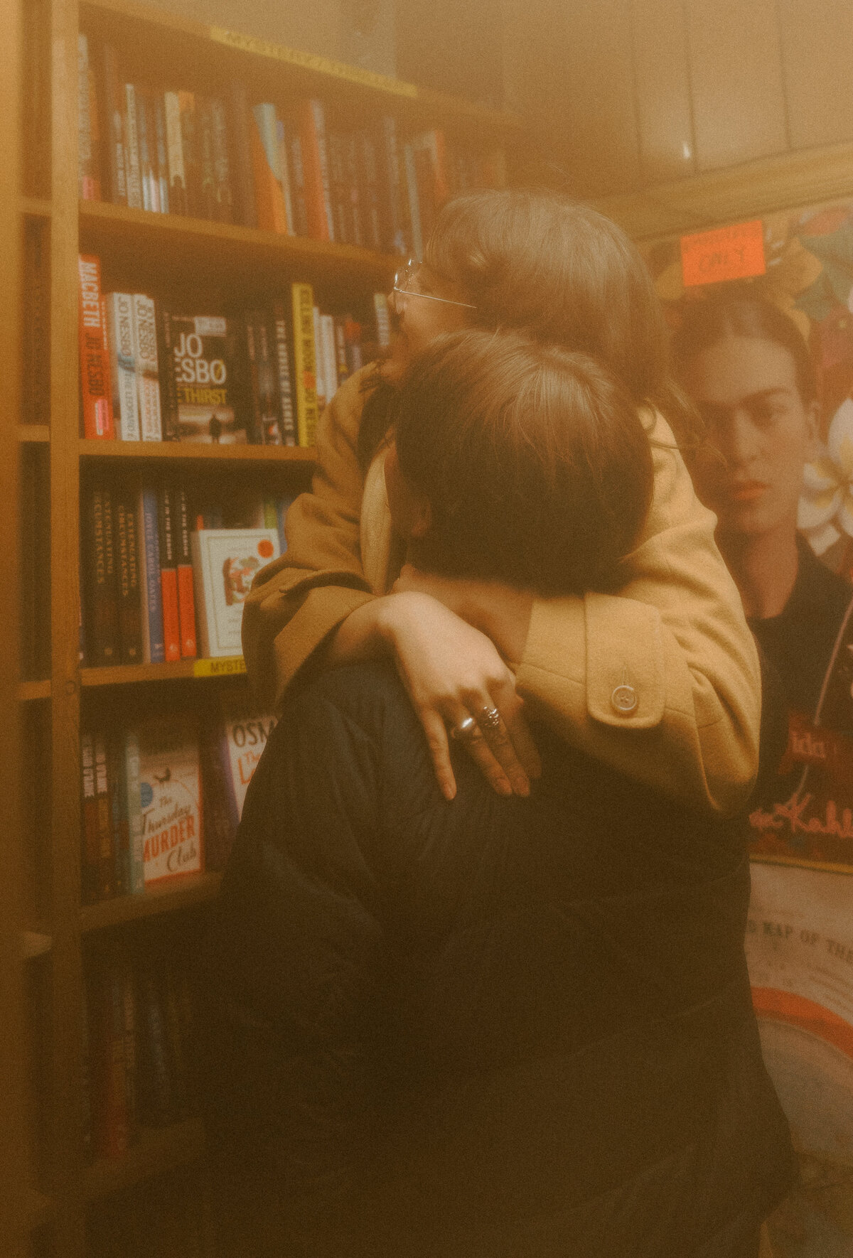 35mm film photography of couple hugging at a bookstore