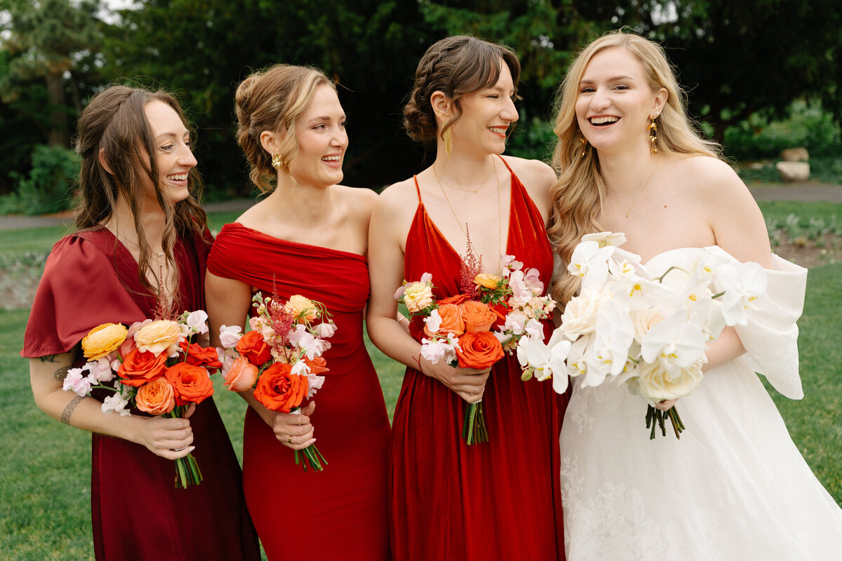 bright bold summer wedding bridesmaids red bouquets