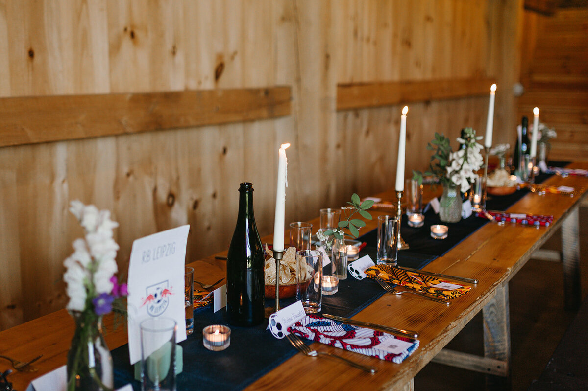 Maine tablescape with lit candles at wedding reception