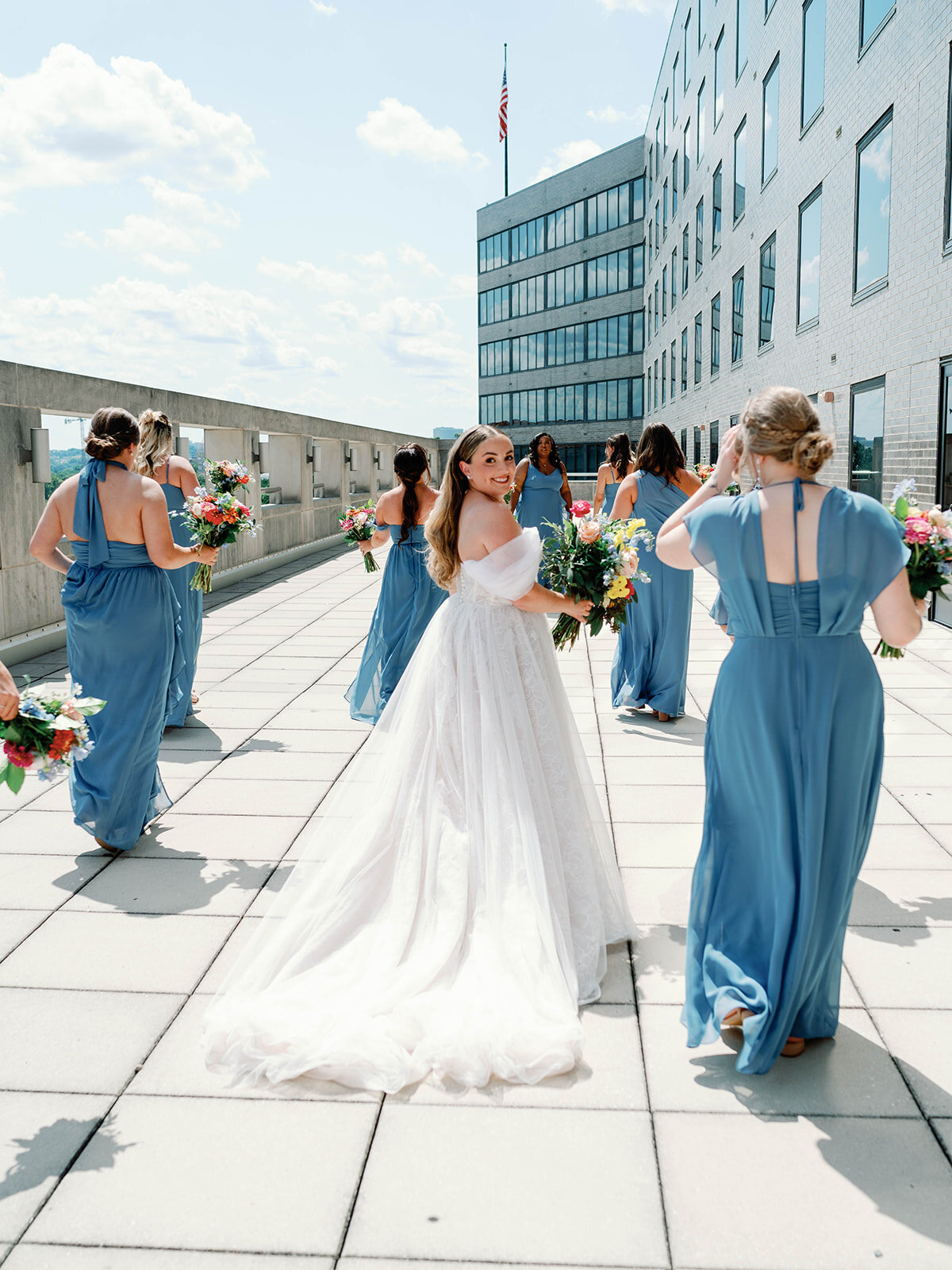 Bride and her bridesmaids walking