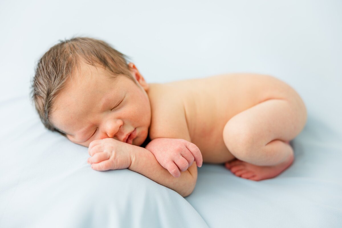 studio newborn pose