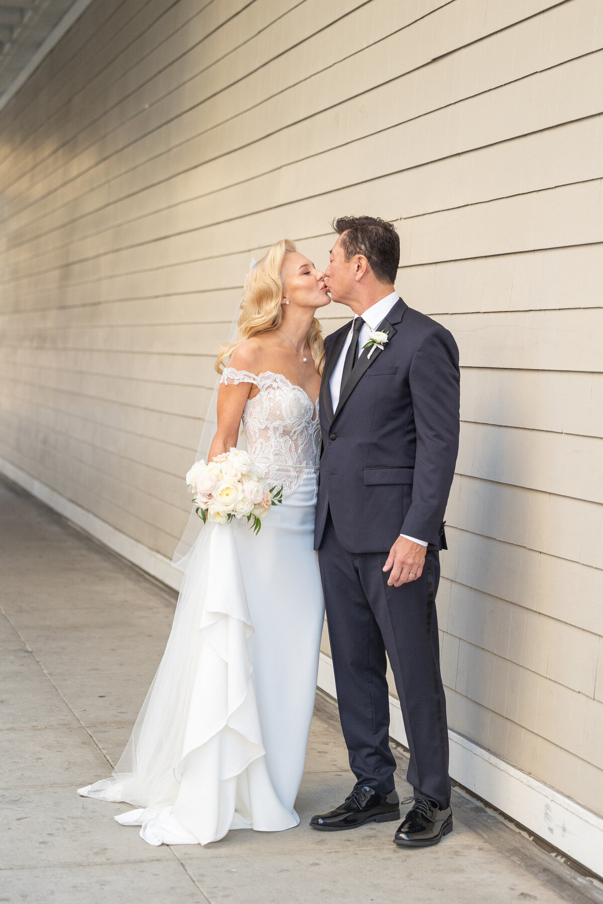 A bride and groom kissing