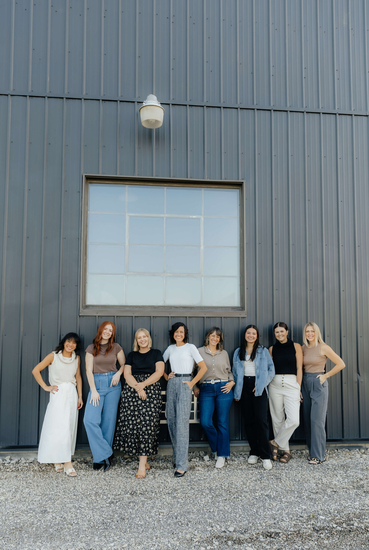Women-led business team posing outside studio, Ohio brand photography for small businesses that want stylish, approachable team imagery
