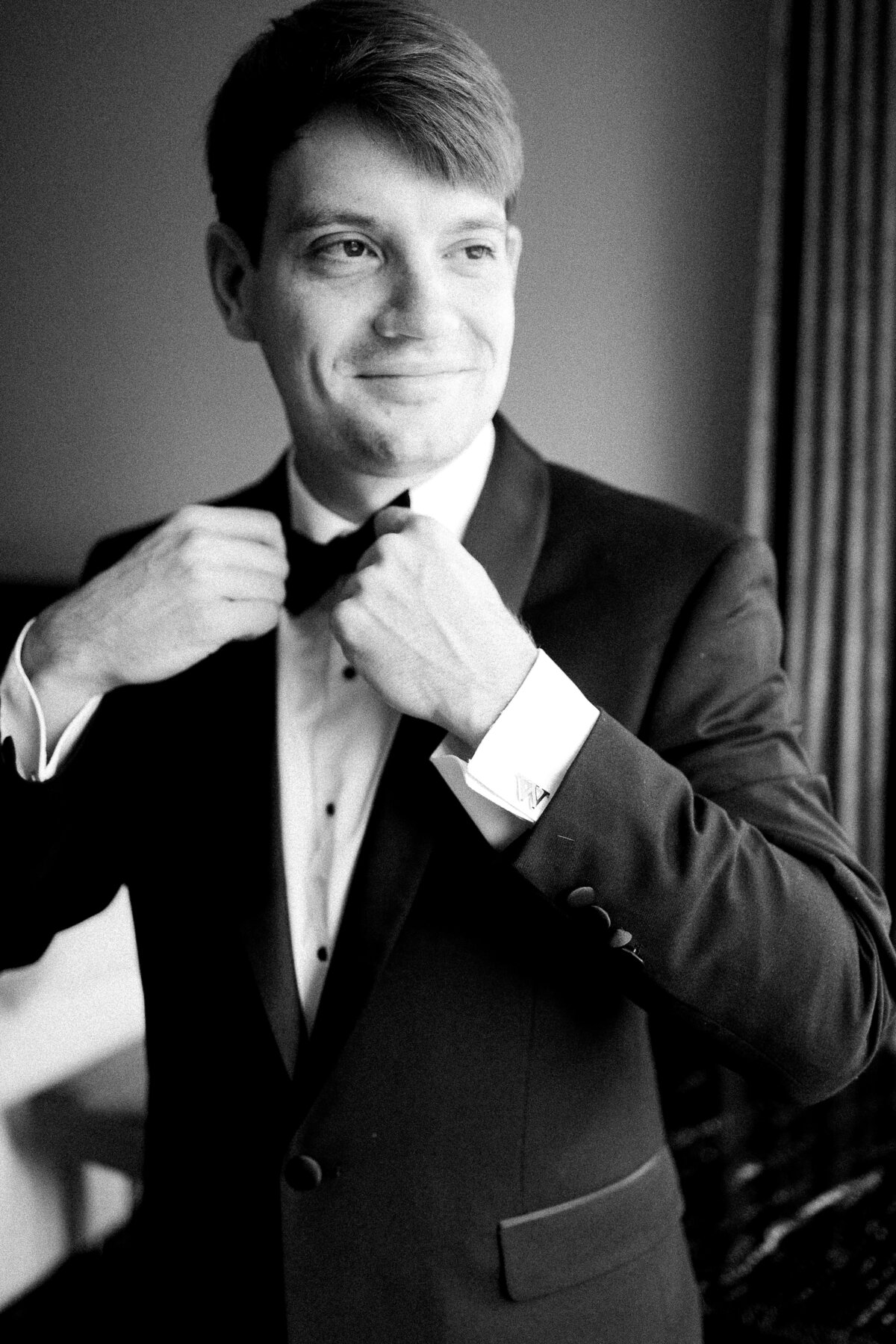 black and white groom portrait