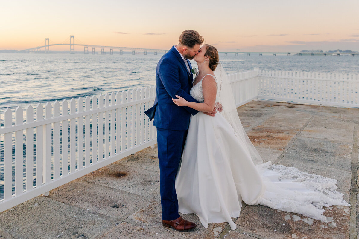 bride and groom kissing on Goat Island in Newport