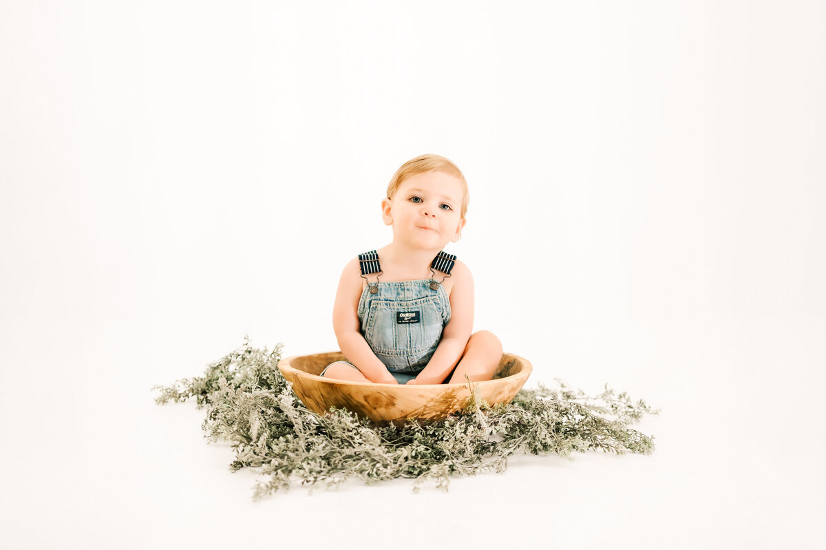 baby boy making funny faces during Springfield MO milestone photography 1st birthday photography session
