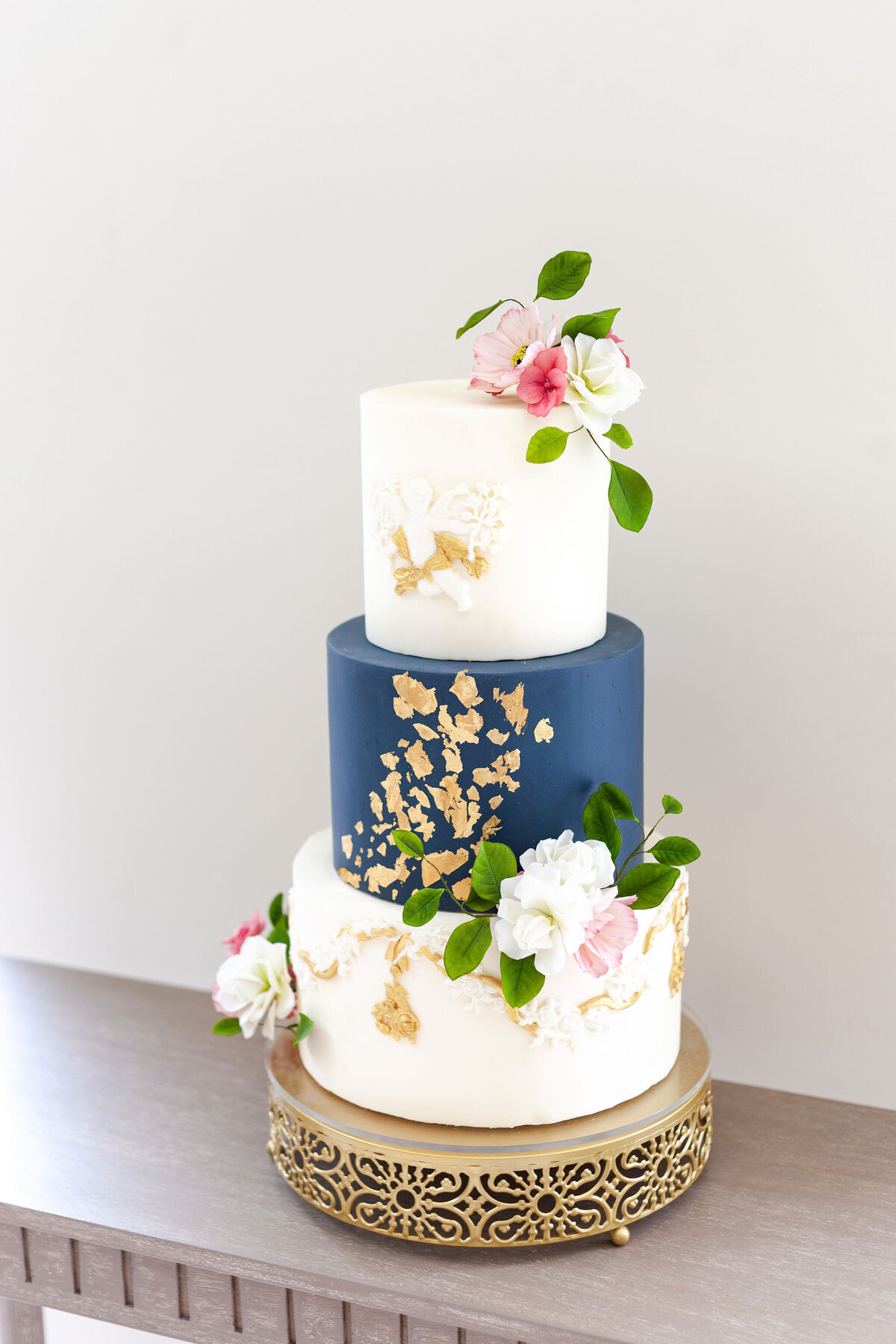 Luxury nature inspired wedding cake designer vanilla Spice Cake Studio Northamptonshire navy white gold leaf 3 tier sugar flower design