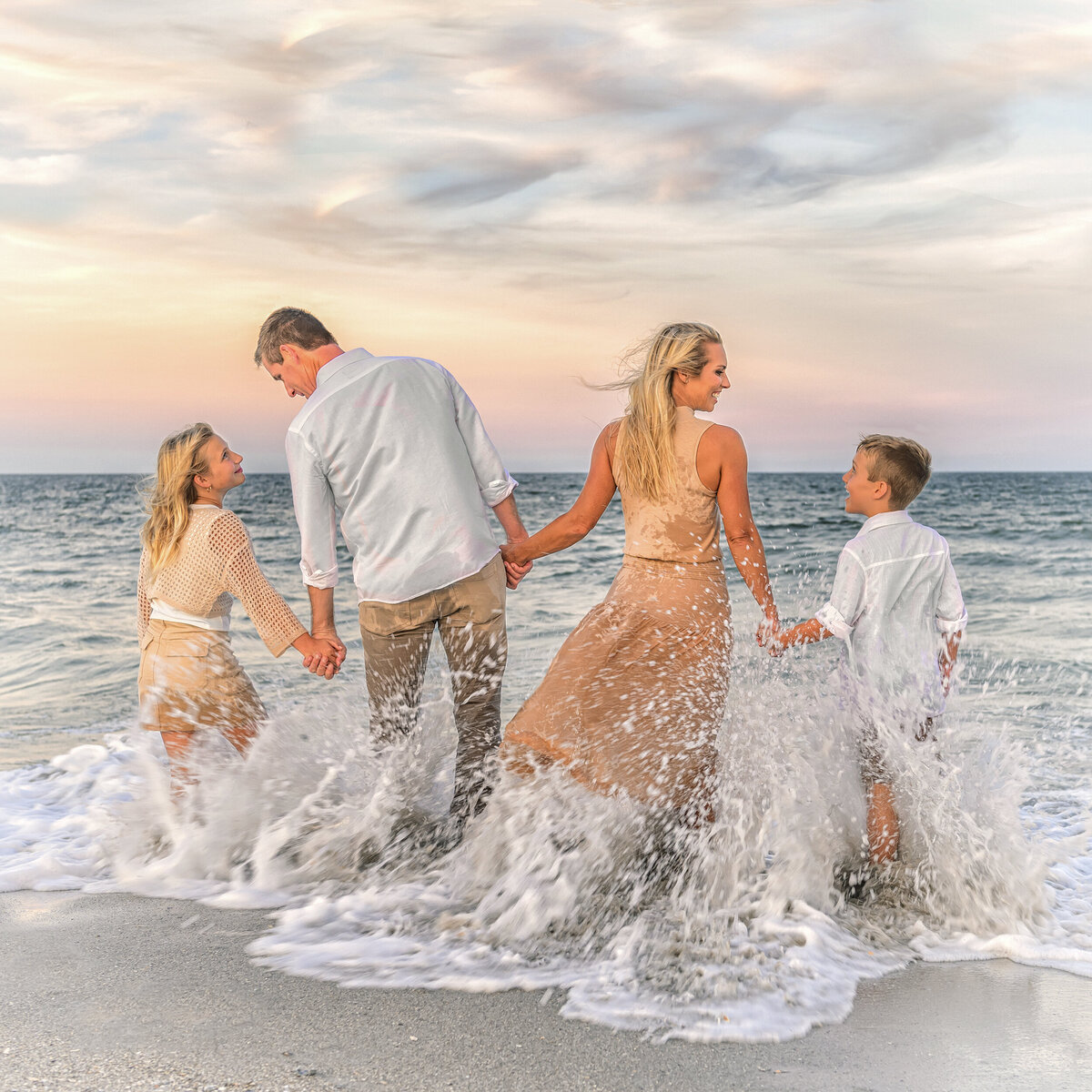 family portrait playing in water at melbourne beach