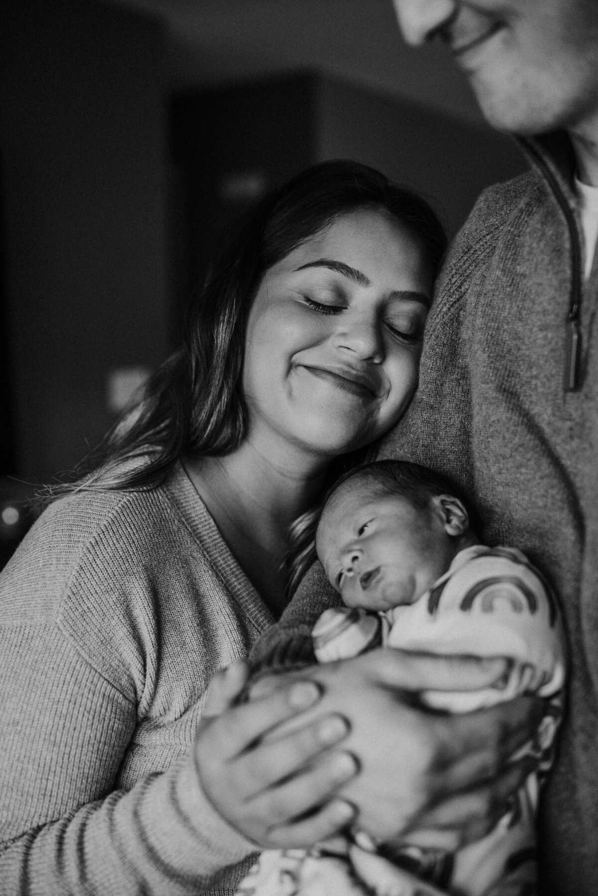 Rock in love's cradle with St. Paul newborn photography at home. Shannon Kathleen Photography immortalizes the nurturing embrace of your family in the heart of your home.