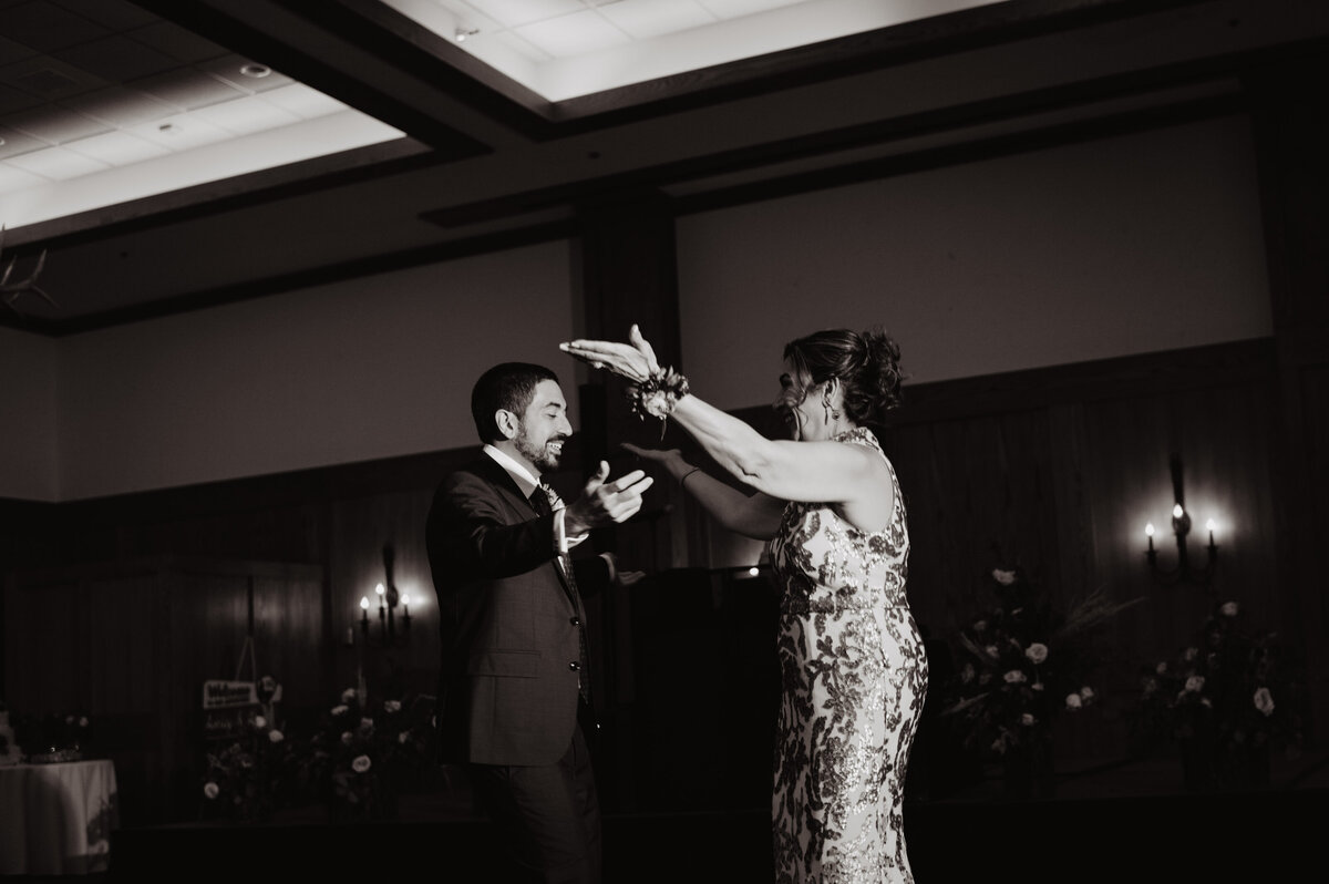 Photographers Jackson Hole capture groom dancing with mother