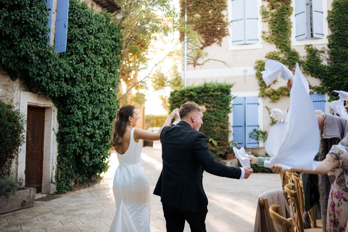 wedding-couple-arriving-courtyard-reception-france2