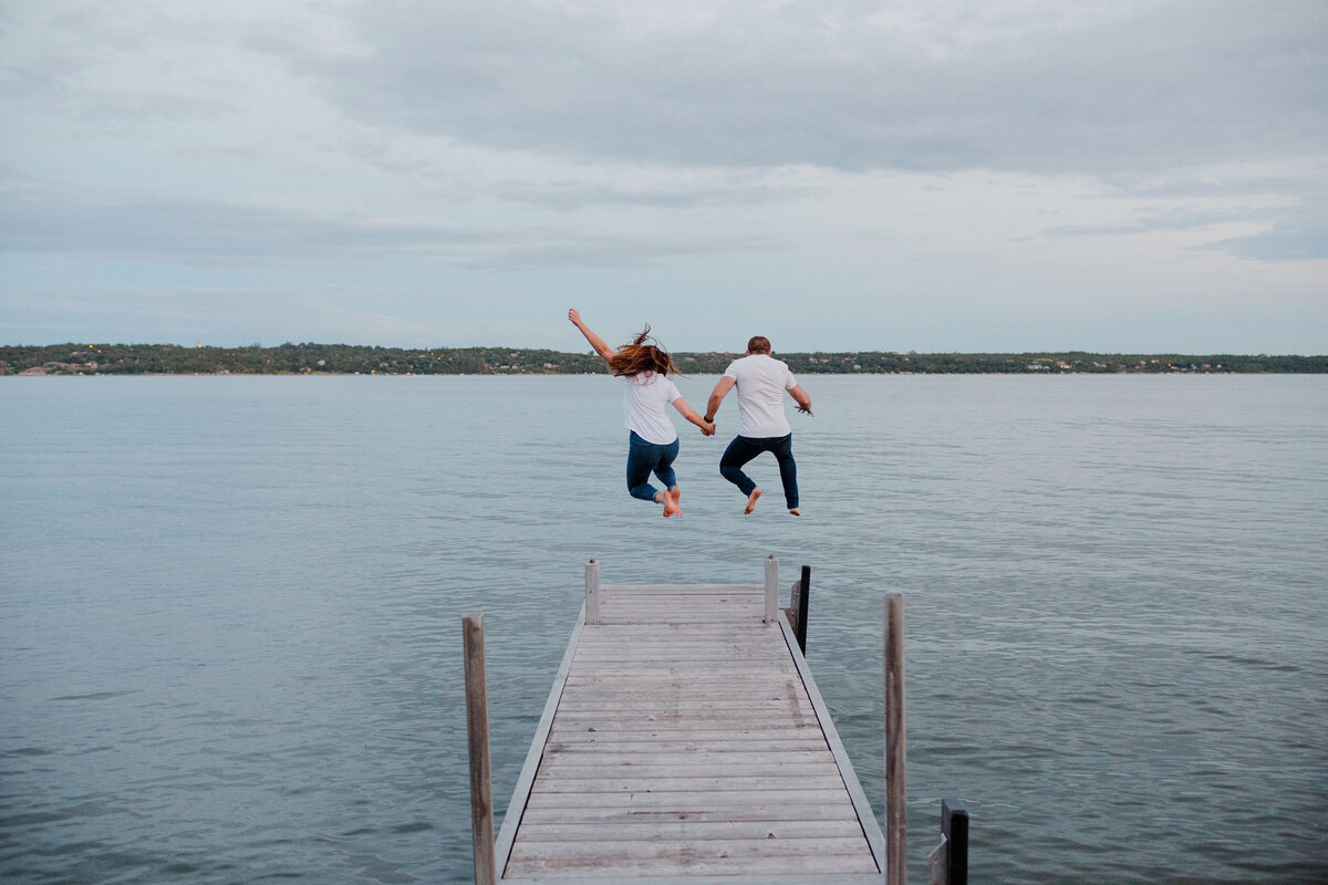 Couple jumps into the lake with their clothes on