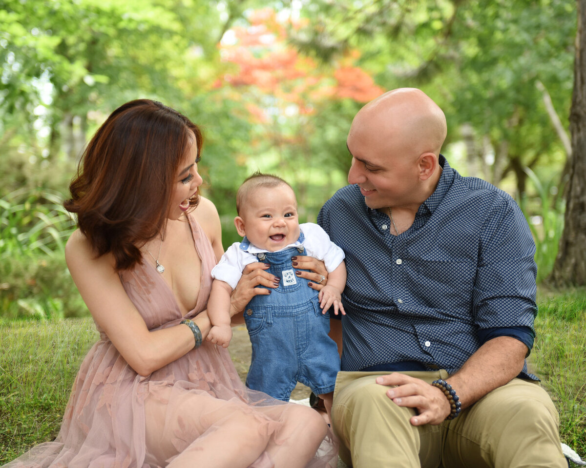 Young family with son photoshoot in park