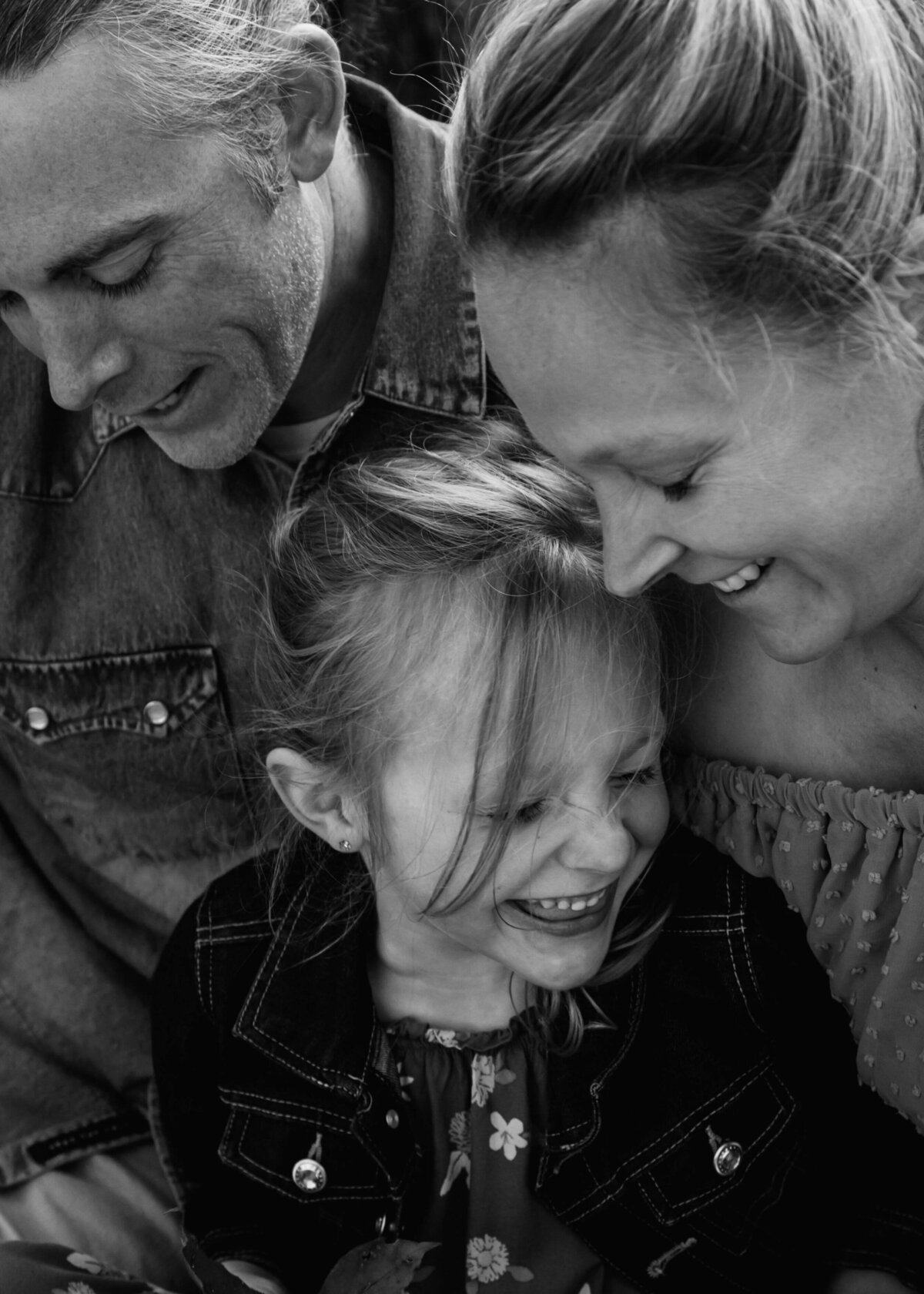 Stunning black and white photo captured by a Pittsburgh family photographer, showcasing a joyous moment of laughter.