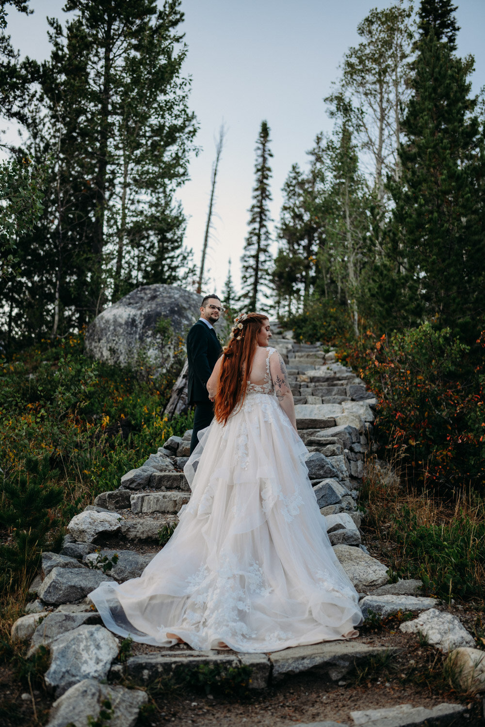 Couple asends rock staircase at Grand Teton National Park