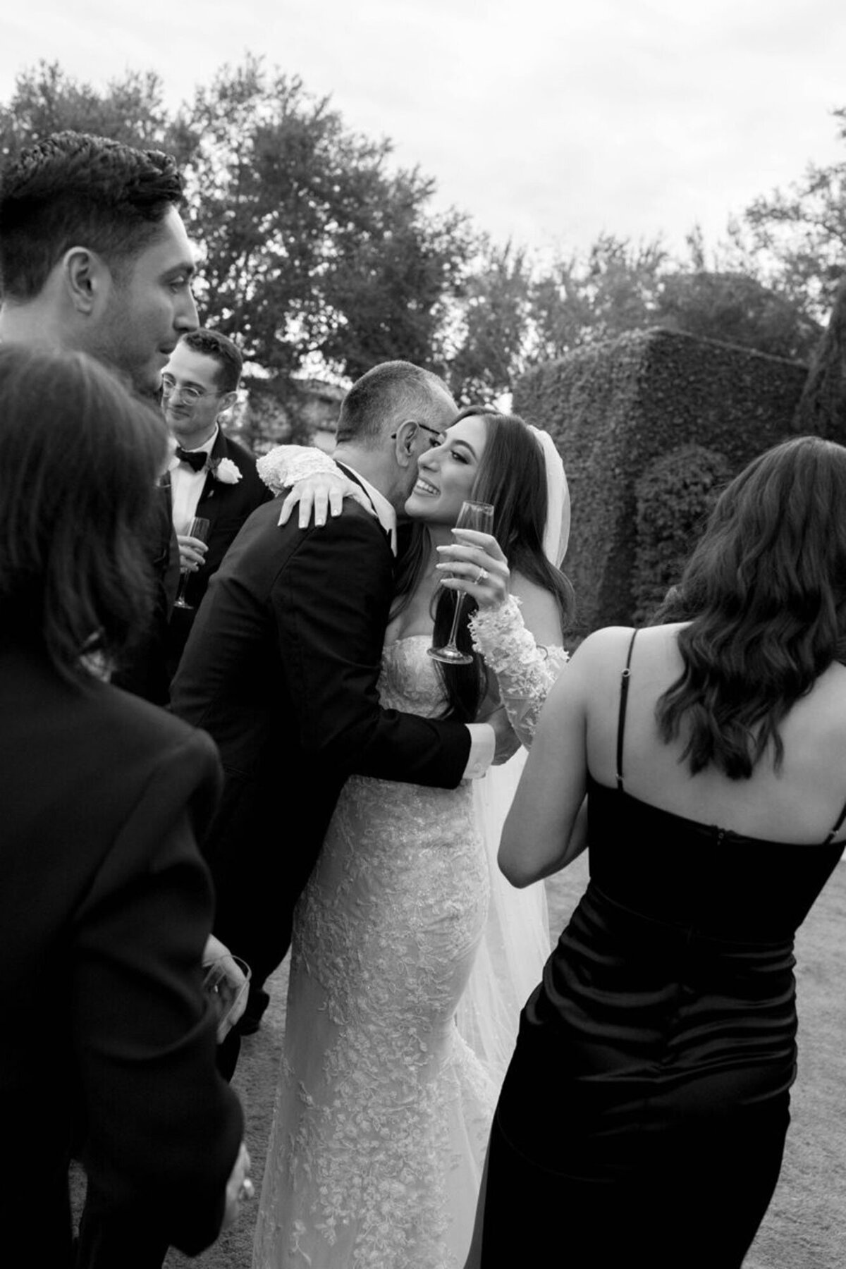 Bride hugging guest, taken by wedding photographers in orlando fl
