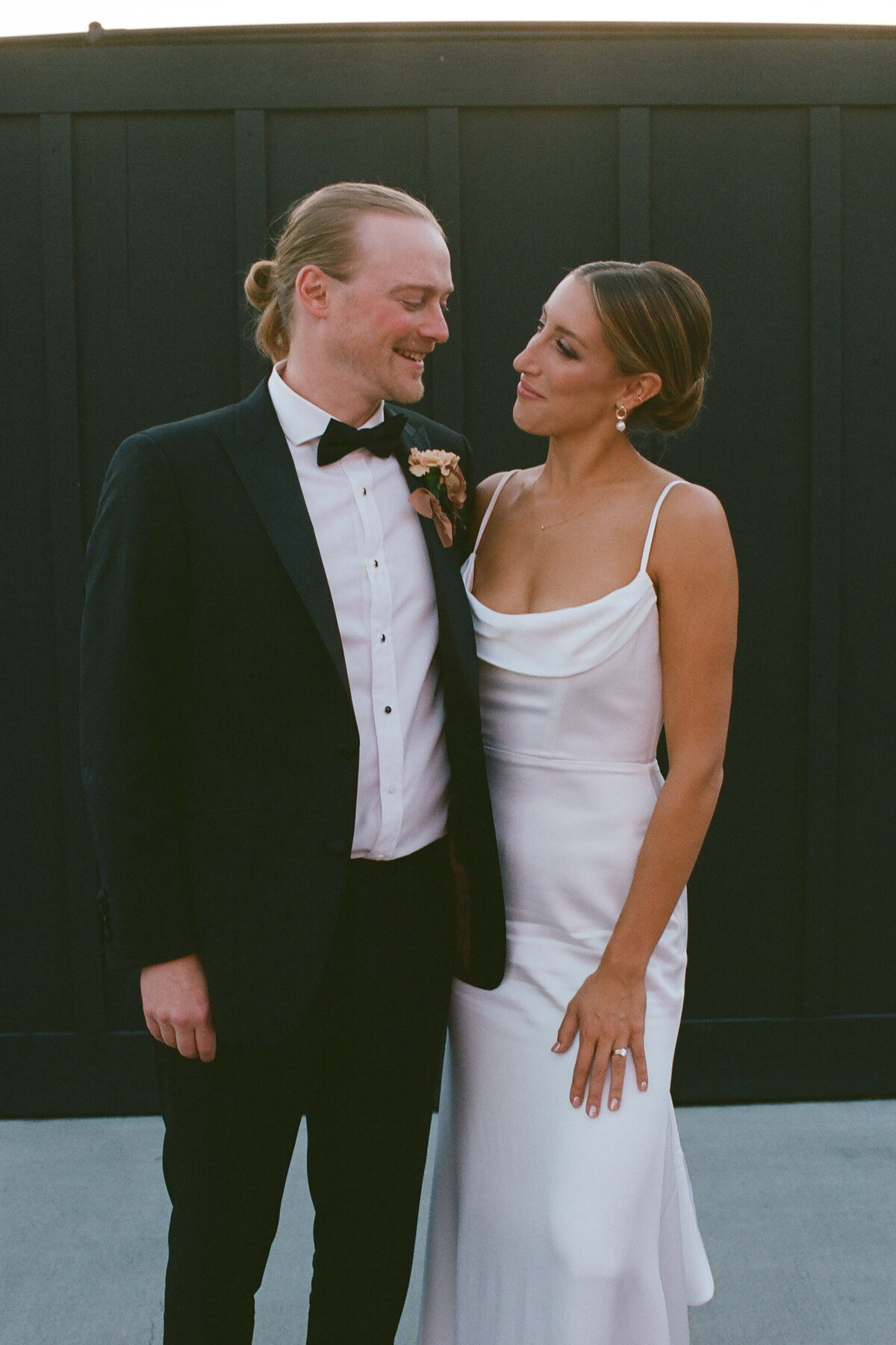 A Portra 400 35mm film scan of a chic bride and groom. Captured by Fort Worth wedding photographer, Megan Christine Studio