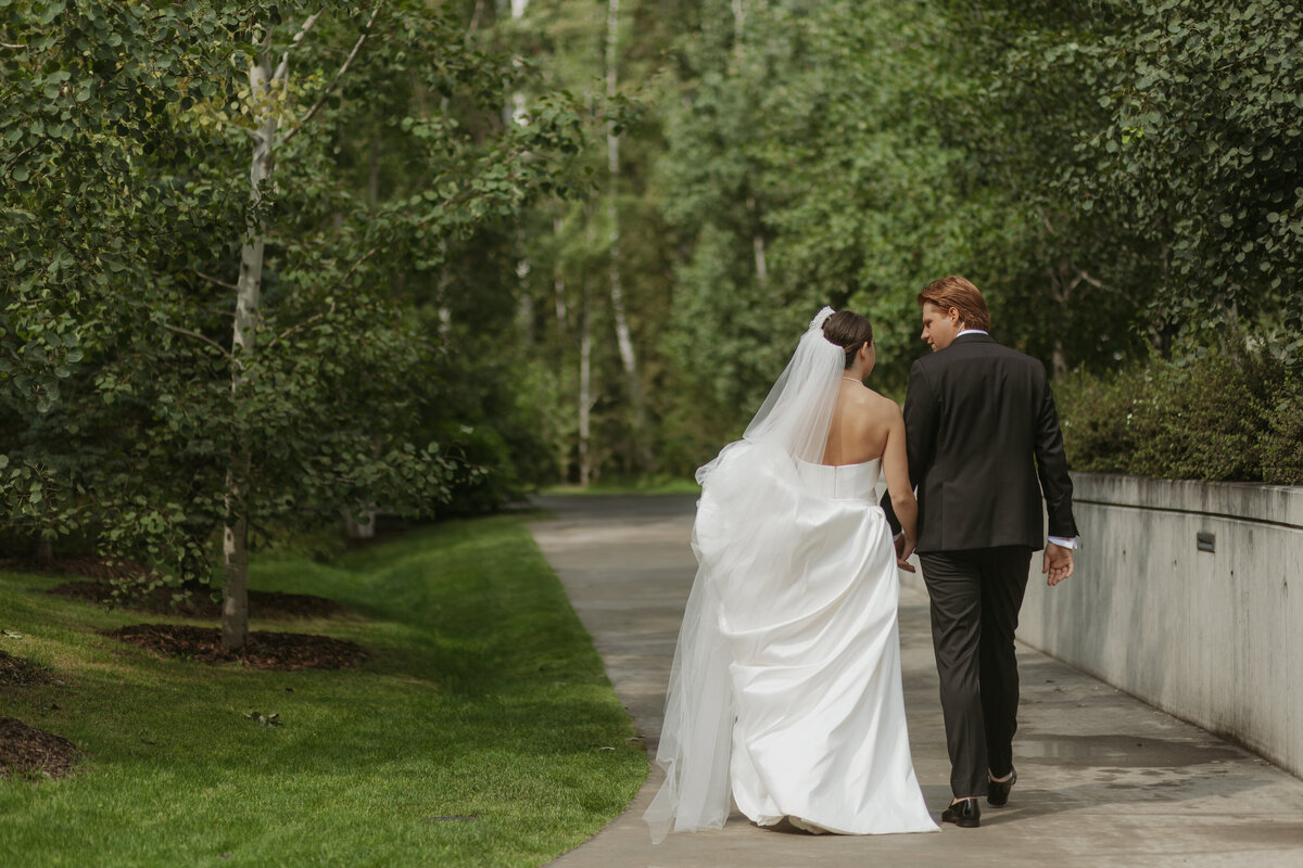 Bride and groom walking away after Edmonton ceremony