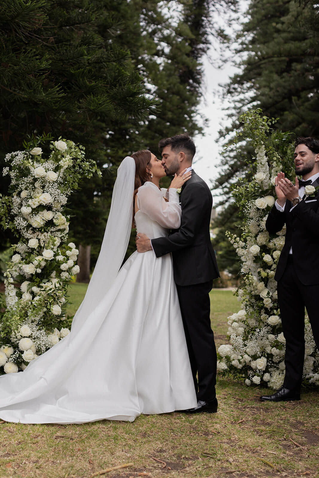 bride and groom's first kiss during their wedding ceremony 