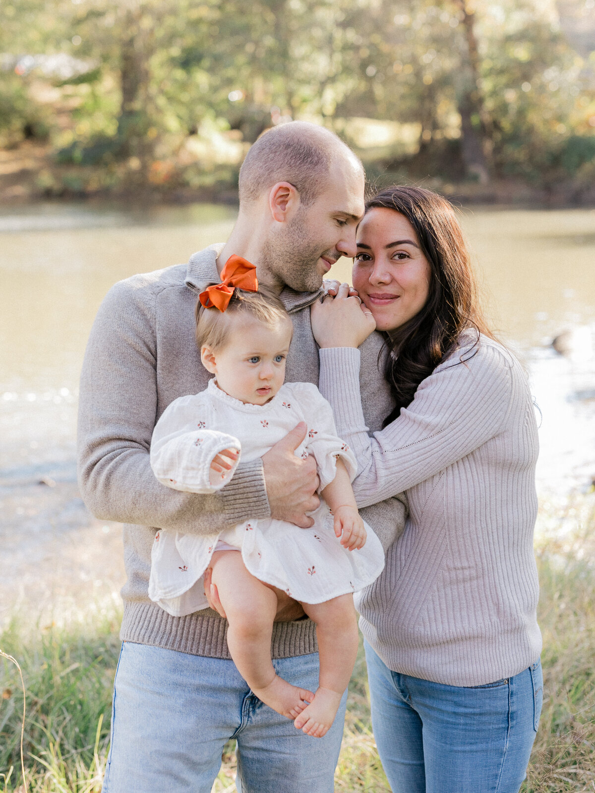 Fall family session at Lake Peachtree. Family holding hands.