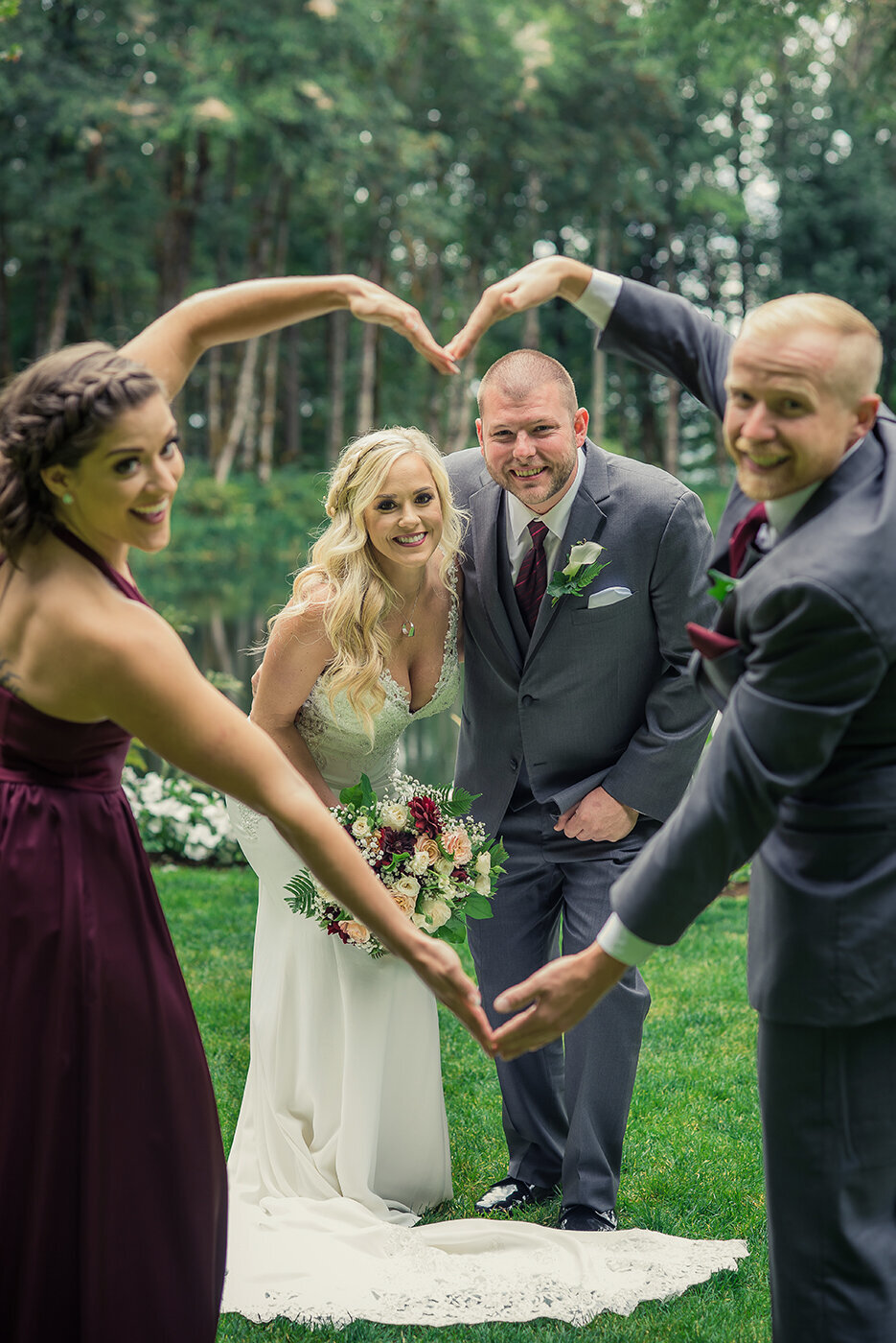 bride and groom behind heart