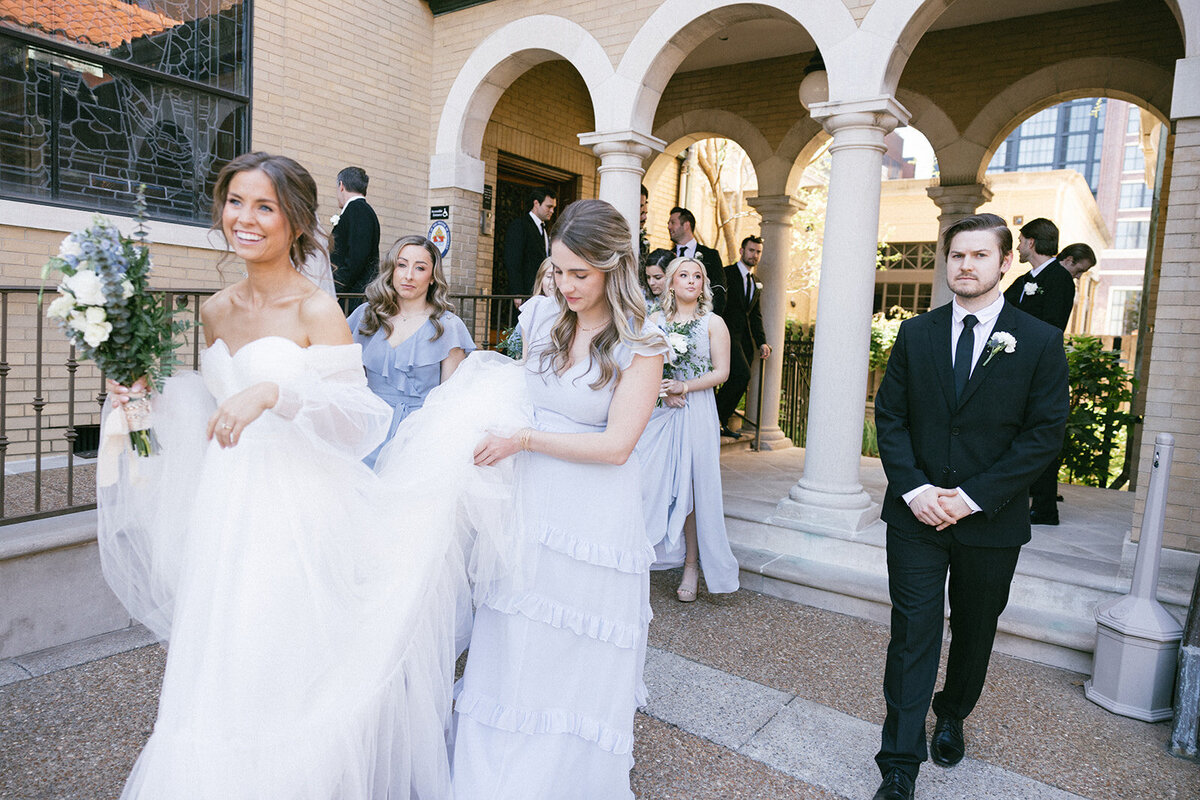 Bridal party in motion after the ceremony at a church in downtown Nashville ends. 