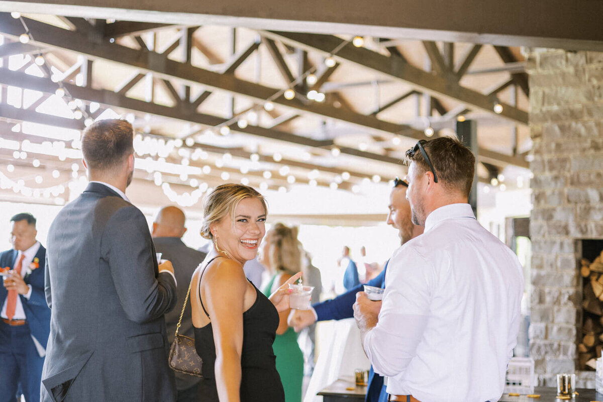 woman-laughing-over-shoulder-at-camera-candid