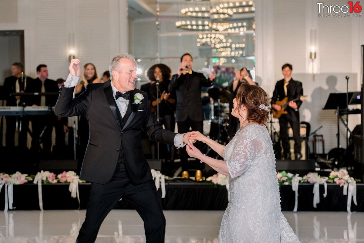 Bride and Groom's first dance with orchestra playing in the background