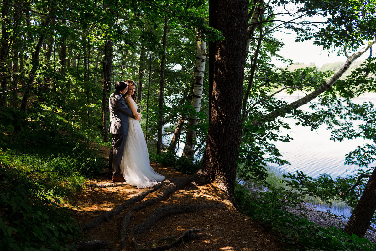 The bride and groom laugh in celebration after being newly married at their Canterbury NH wedding