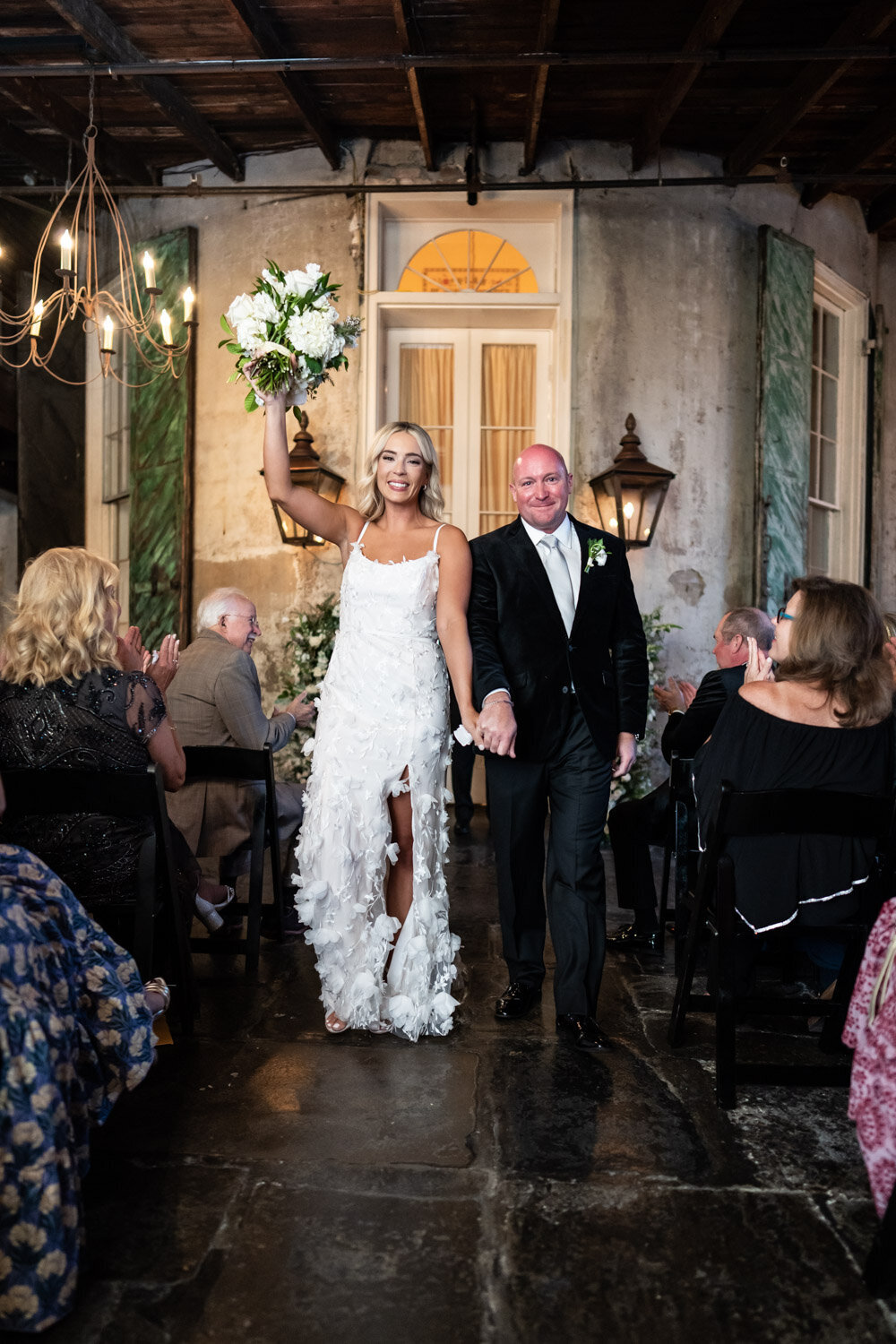 Bride and groom celebrate at end of wedding ceremony