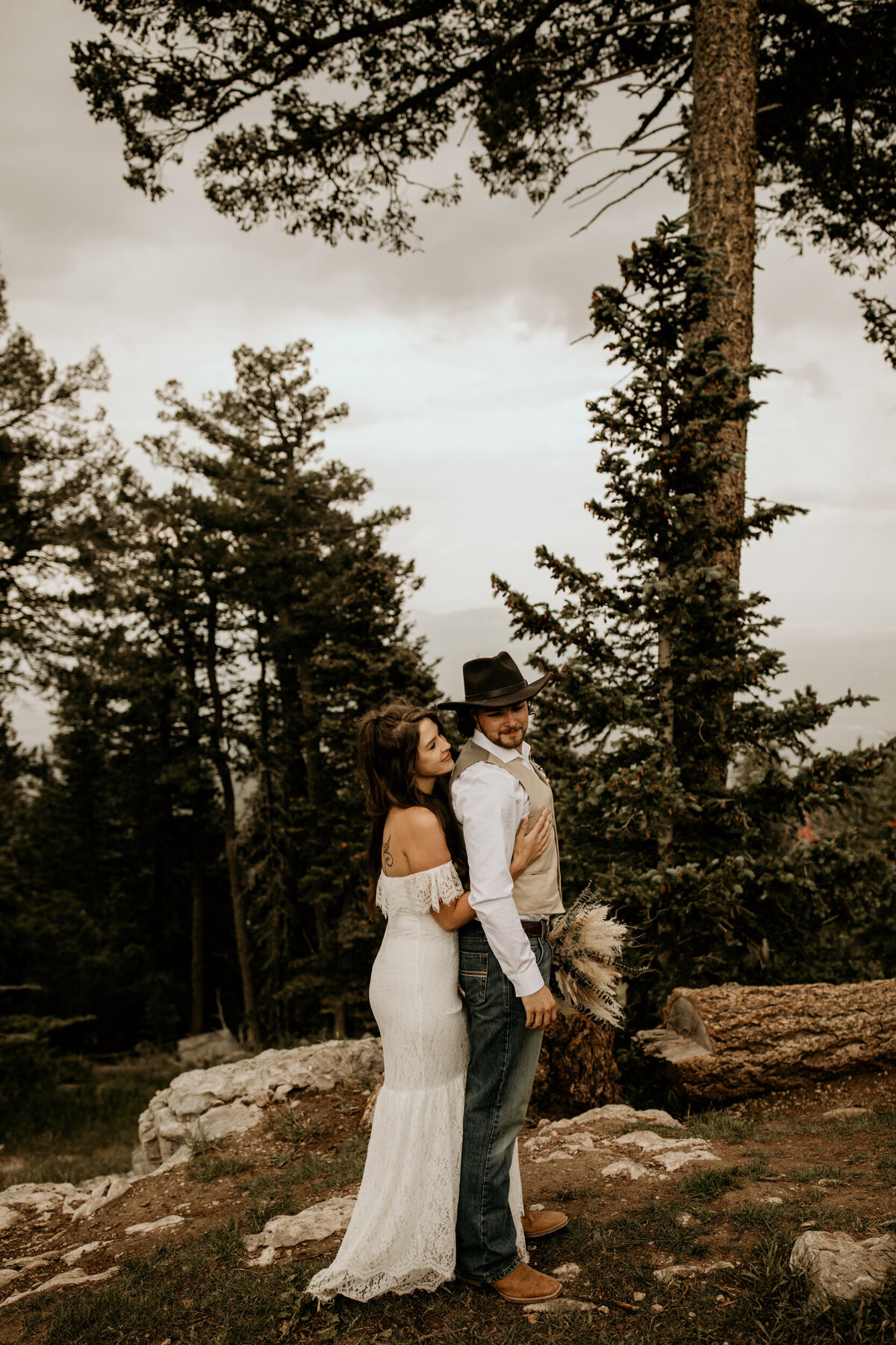 bride hugging her new husband from behind in New Mexico