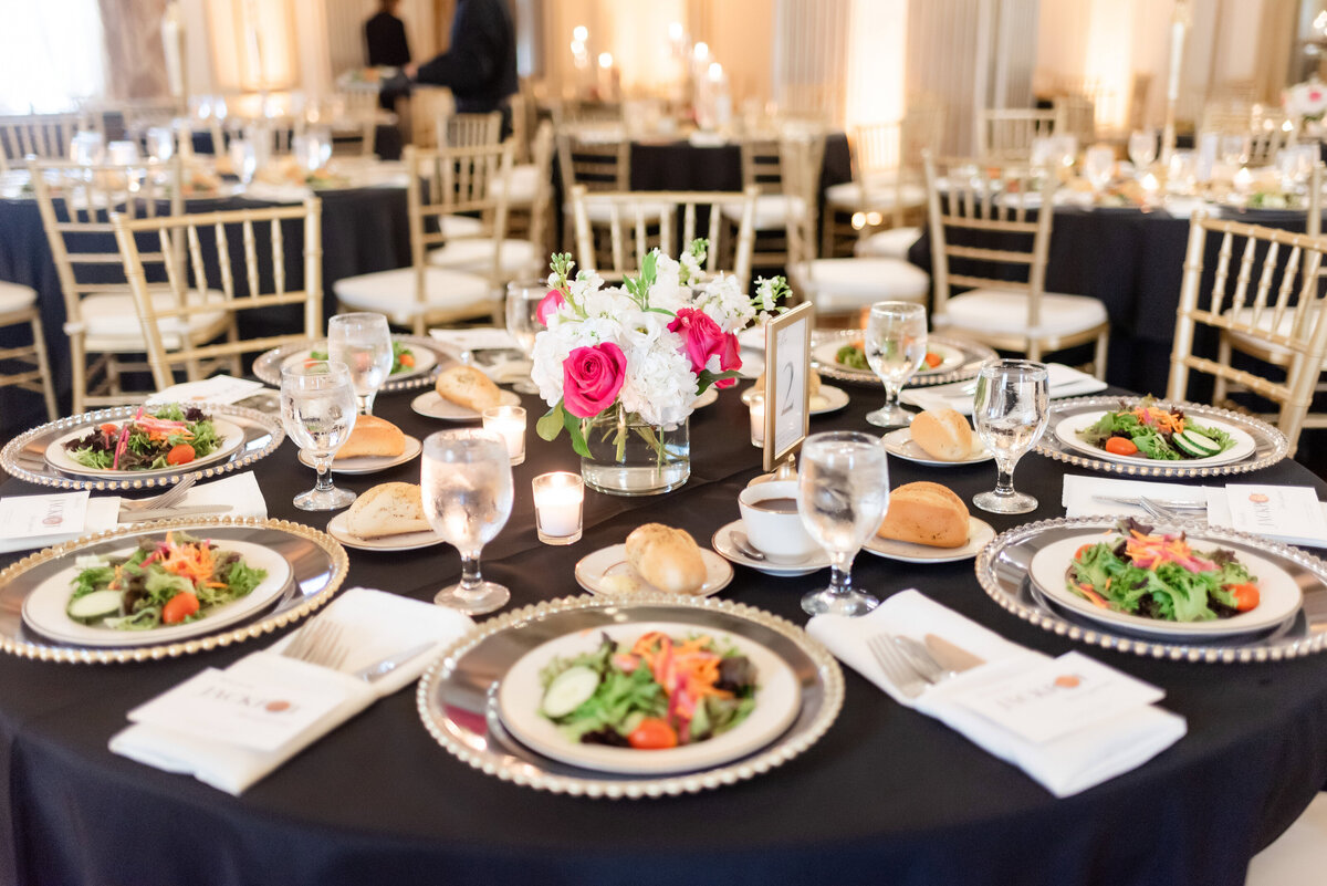 dinner setup at a wedding reception inside of the grand ballroom at the george washington hotel