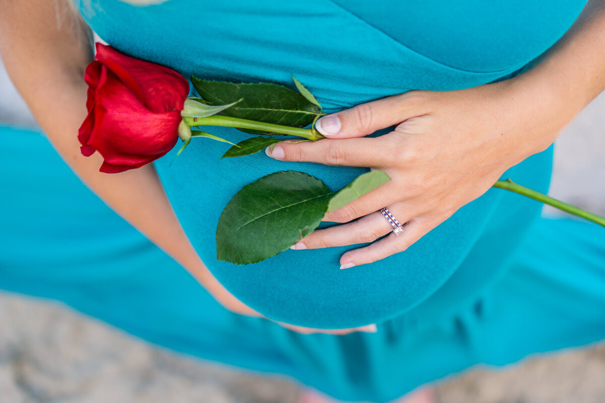 Pregnant baby bump with rose and blue dress Minneapolis Photographer