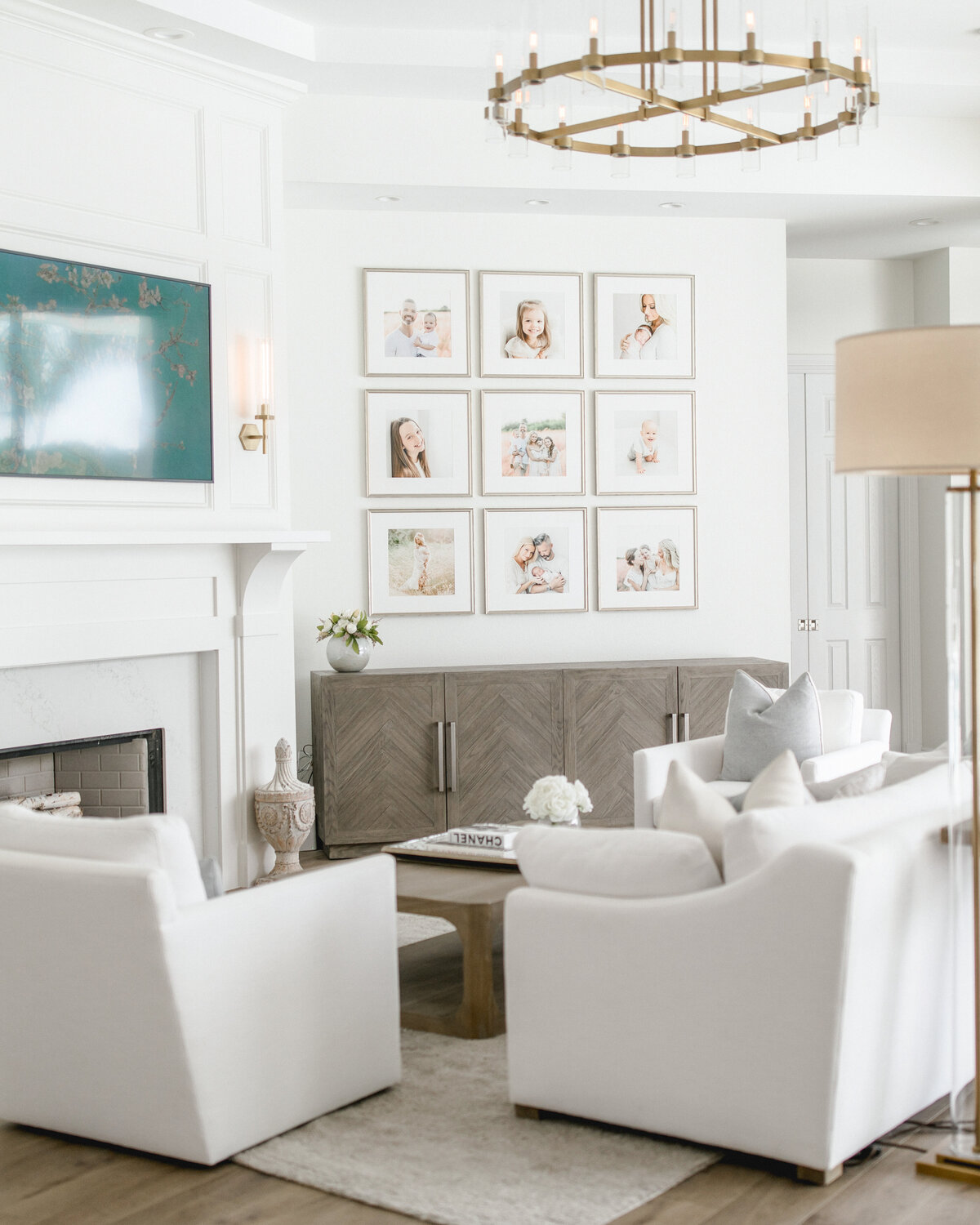 Framed gallery wall with neutral frames above couch – Charlotte wall art installation