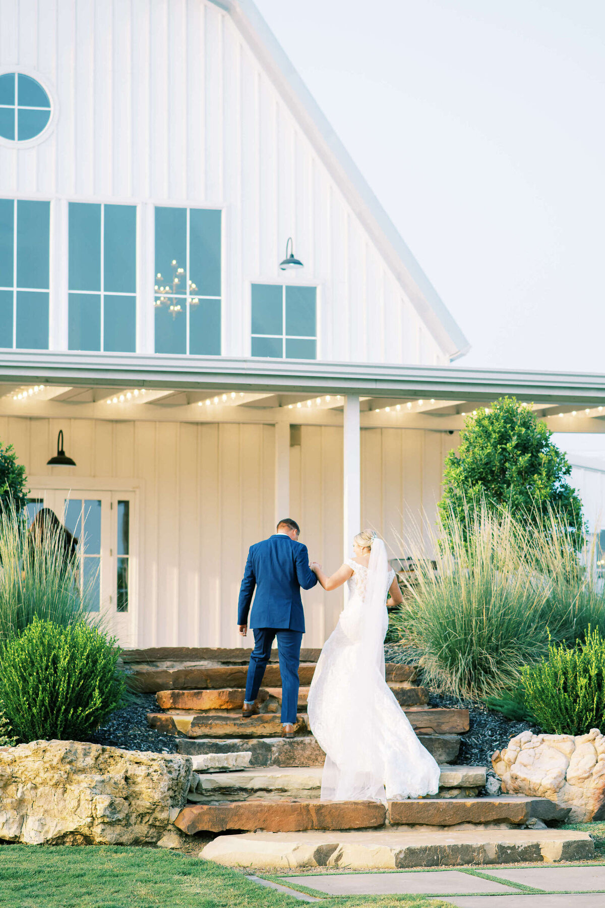 Bride and groom walk to reception at The Nest at Ruth Farms