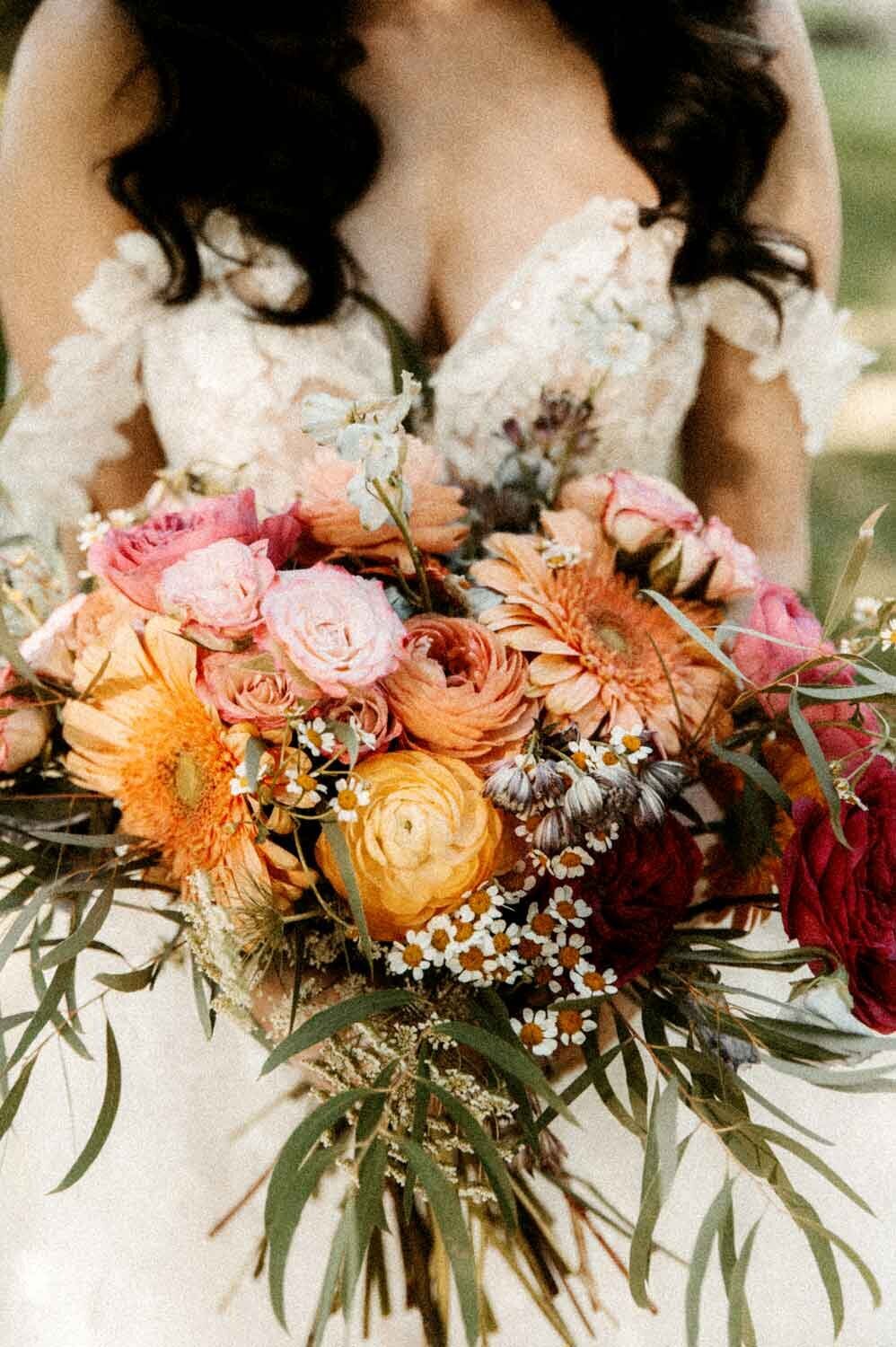 Bride-closeup-holding-colorful-bouquet-at-Vinyard-wedding-St-Louis-Missouri