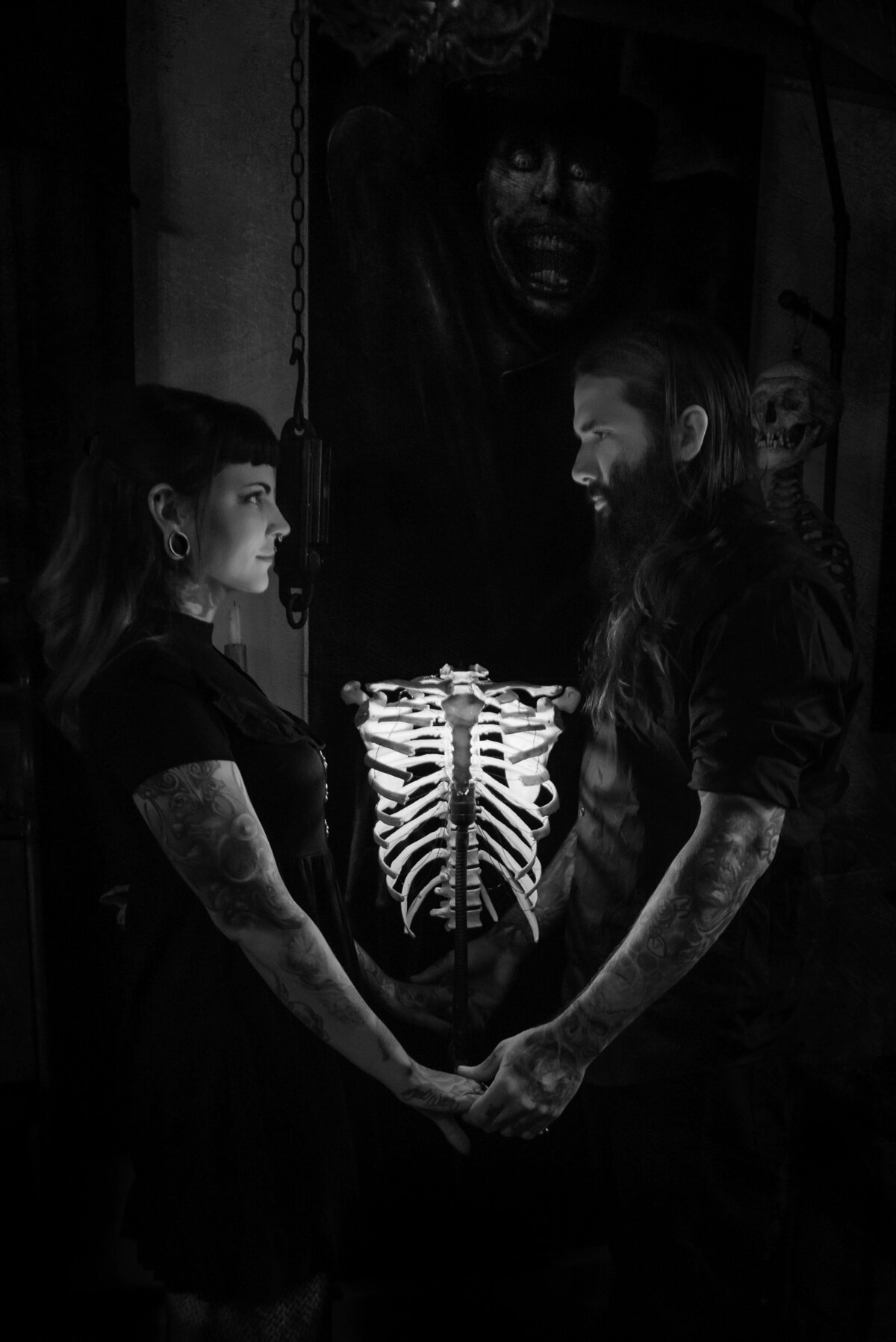 Engaged couple holding hands dark and creepy photography