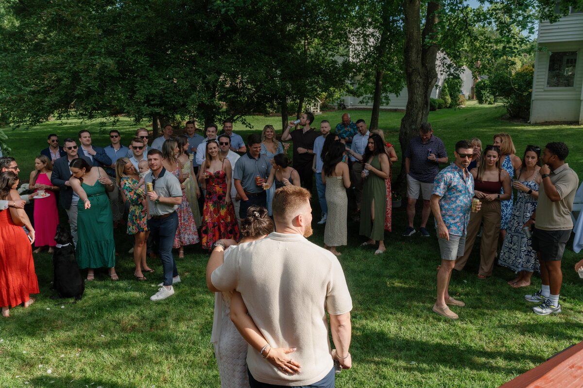 bride-and-groom-backyard-wedding-looking-at-friends