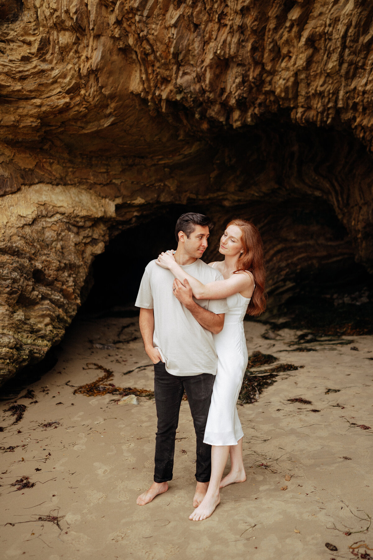 couple shoot for maternity session during golden hour Oregon coast beach wedding/elopement - photographed by The Storytellers