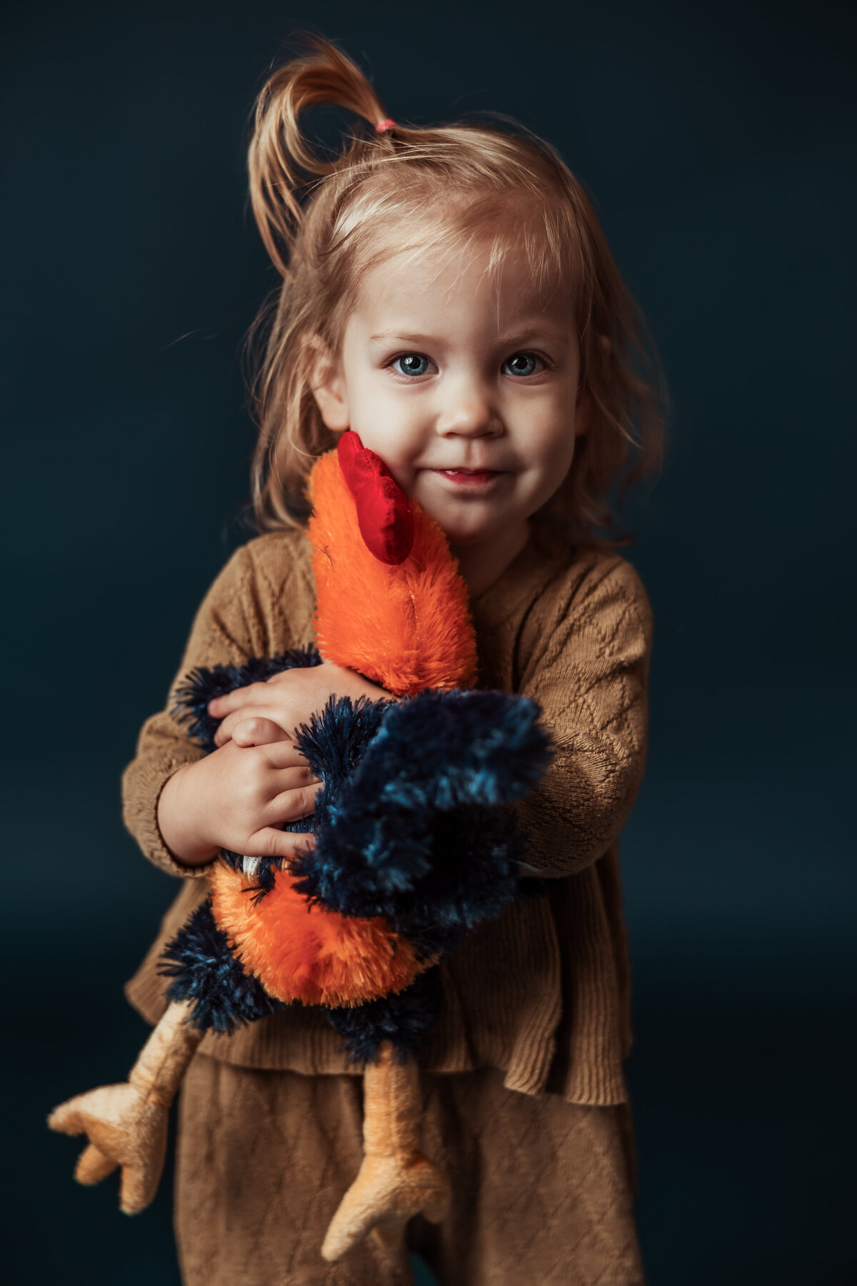 toddler-hugs-chicken-in-studio
