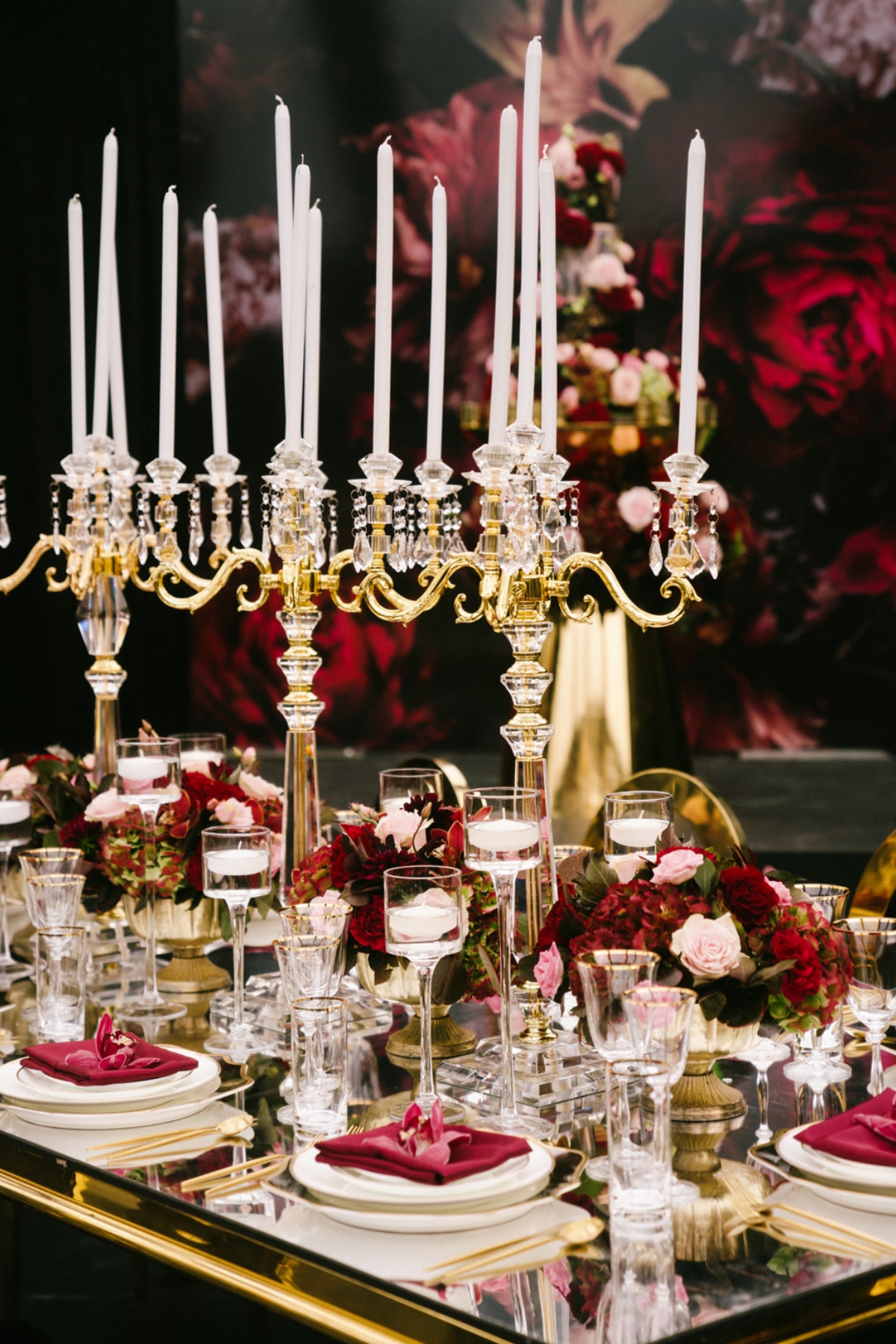 black-gold-burgundy-red-tent-reception-chandeliers-roses-candelabras-napkins-candle