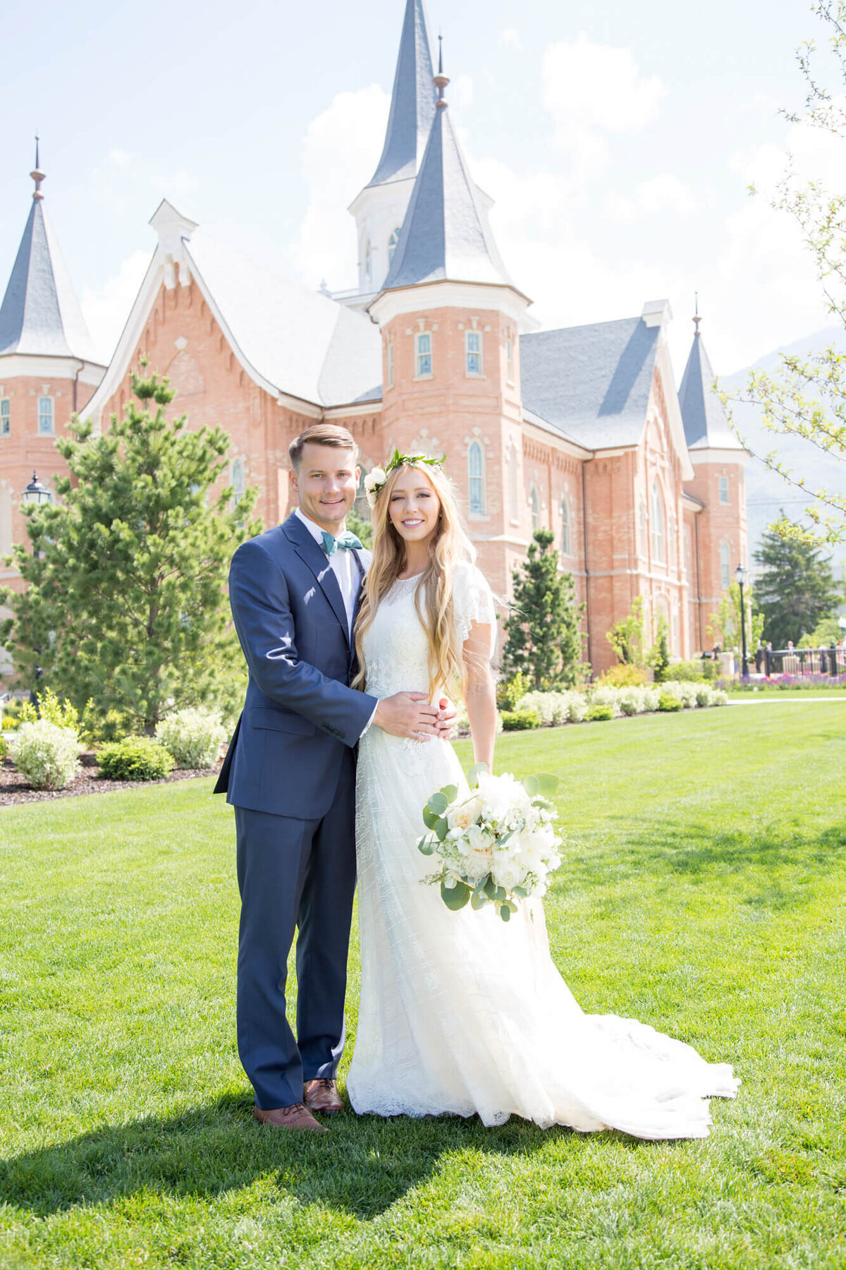 portrait of a wedding couple in front of a building